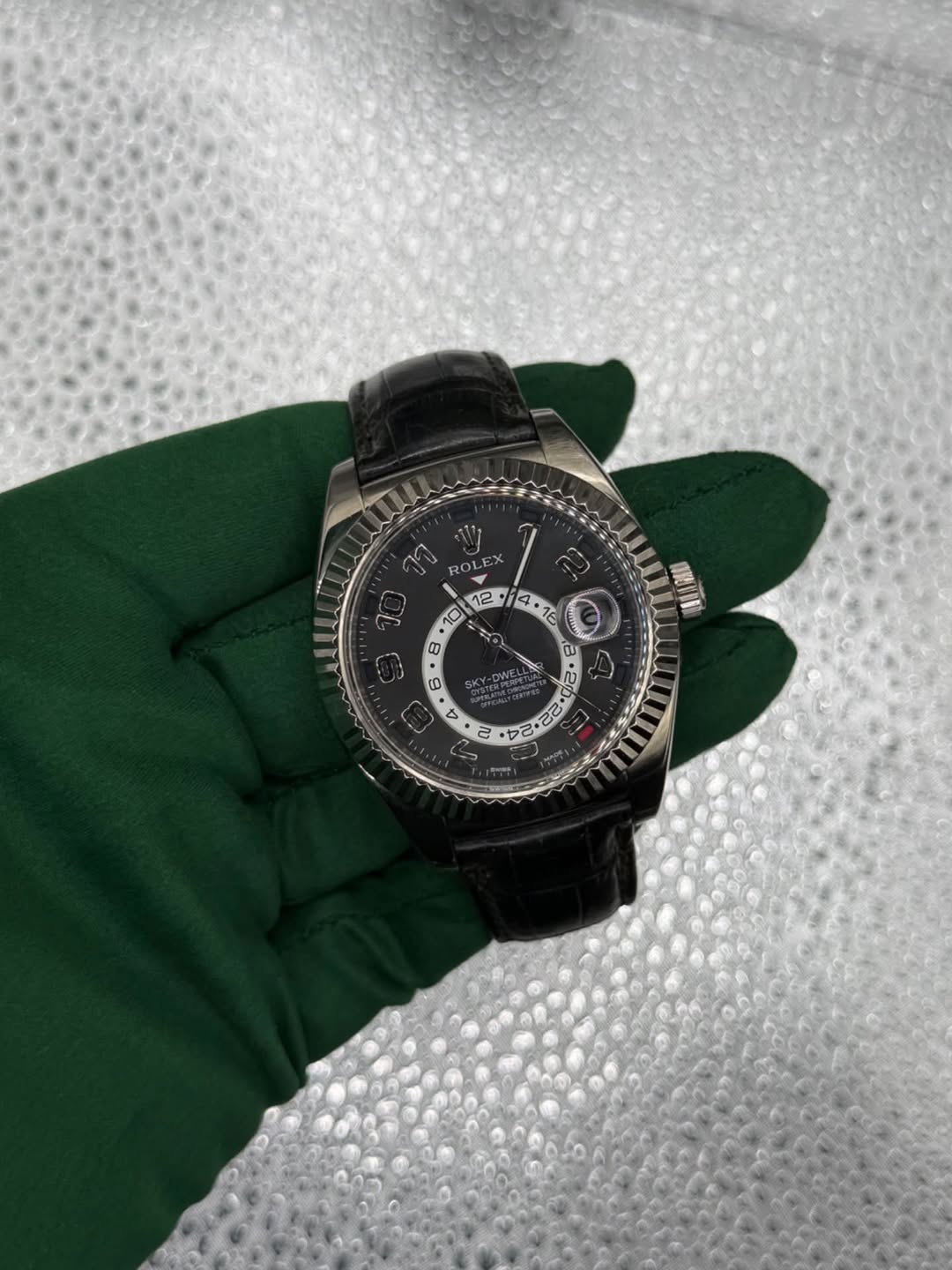 May be an image of wrist watch and text