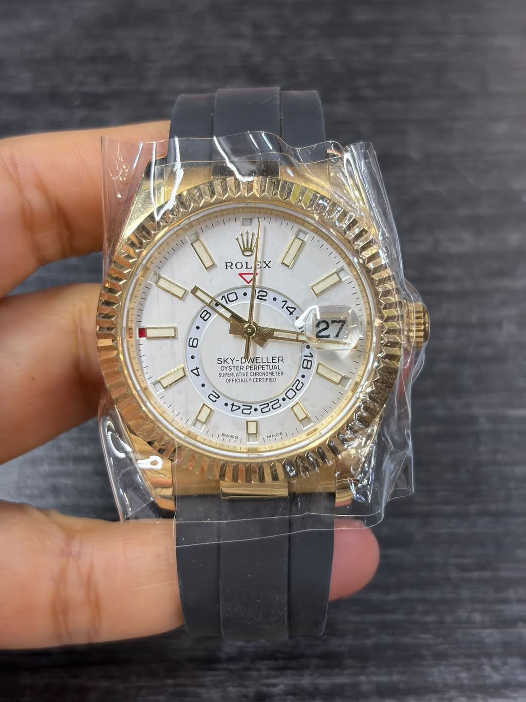 May be an image of wrist watch and text