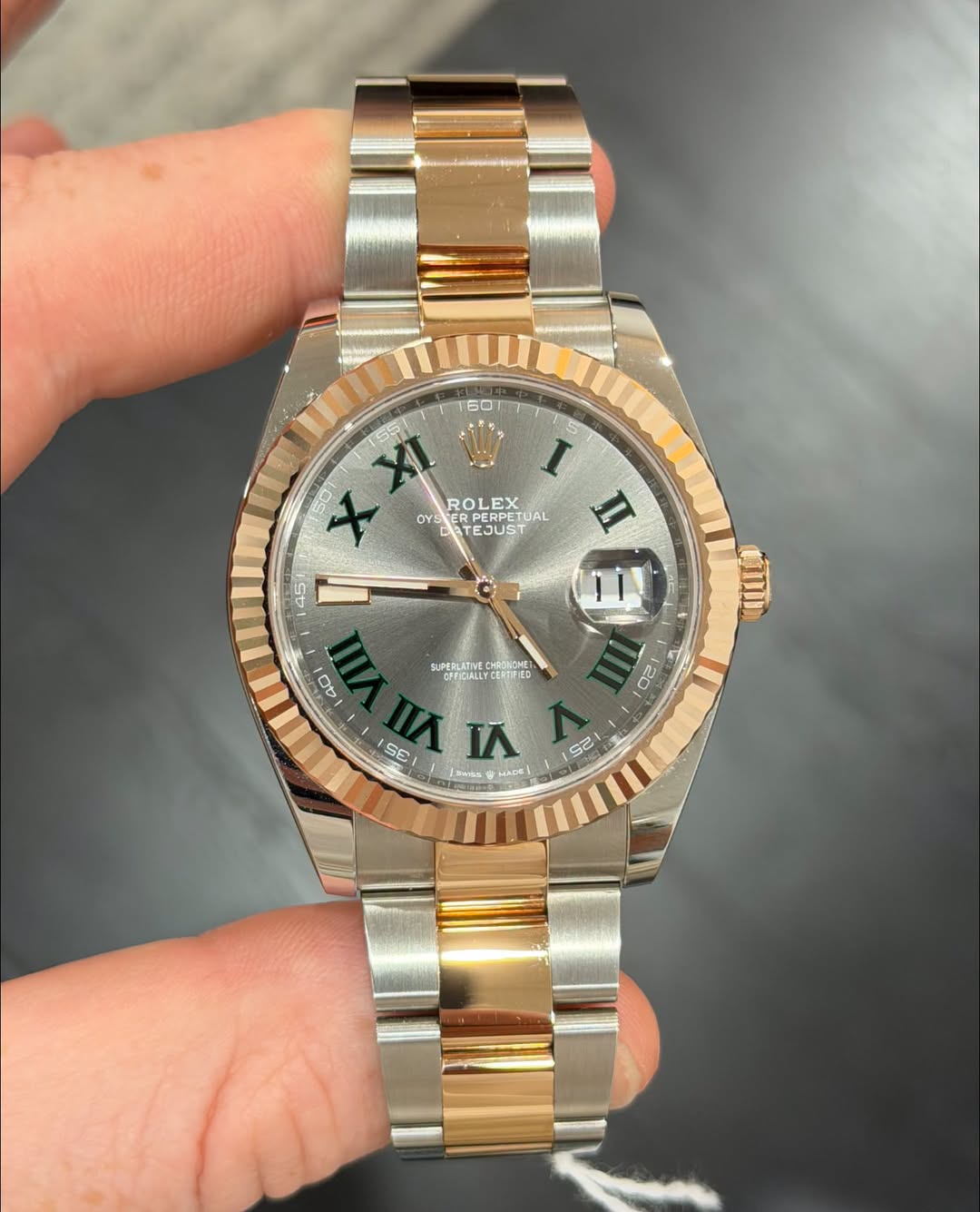 May be an image of wrist watch and text