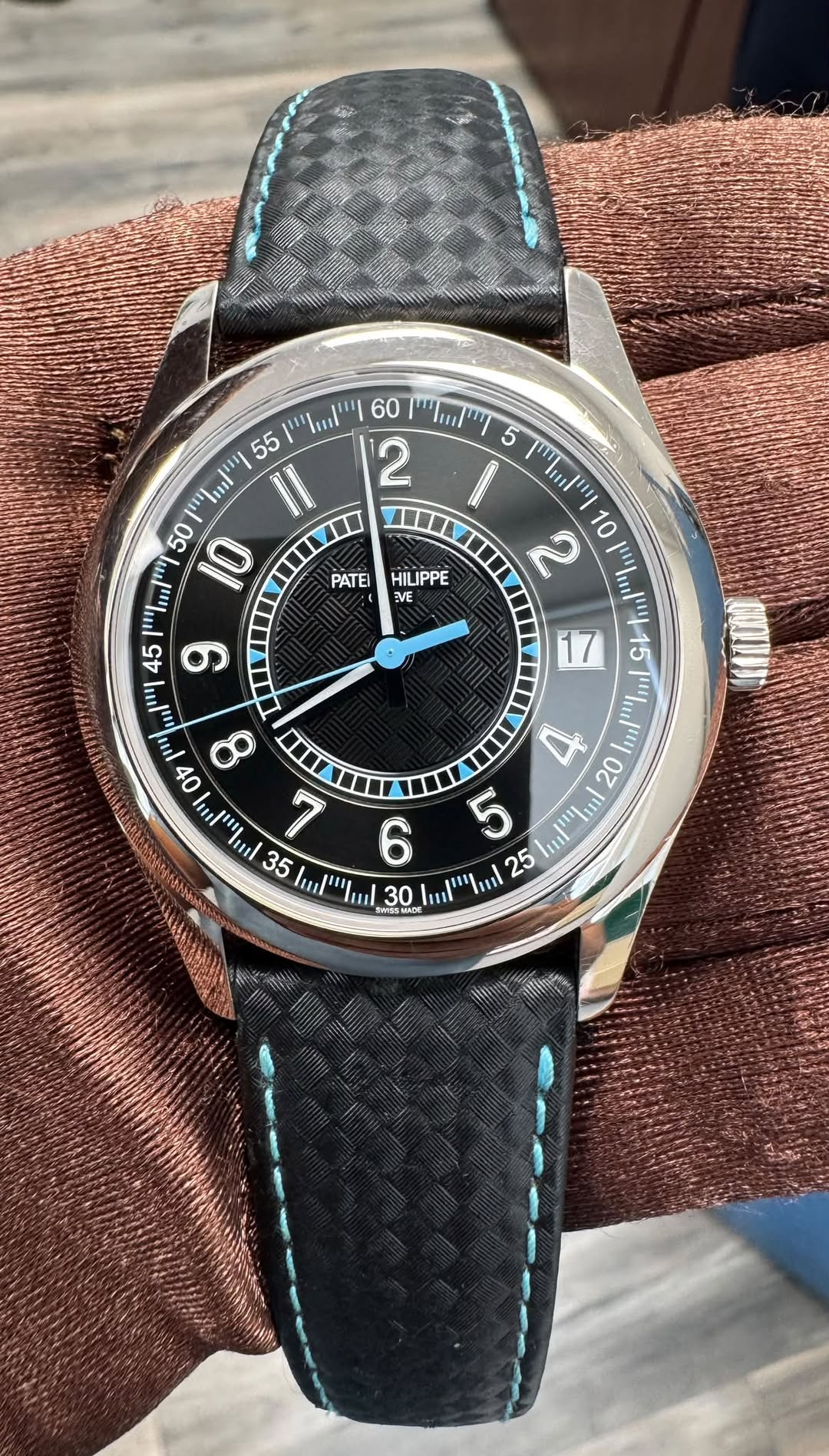 May be an image of wrist watch and text