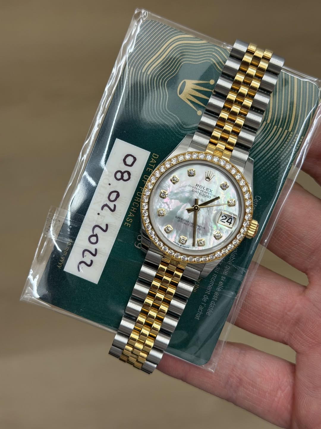 May be an image of wrist watch and text