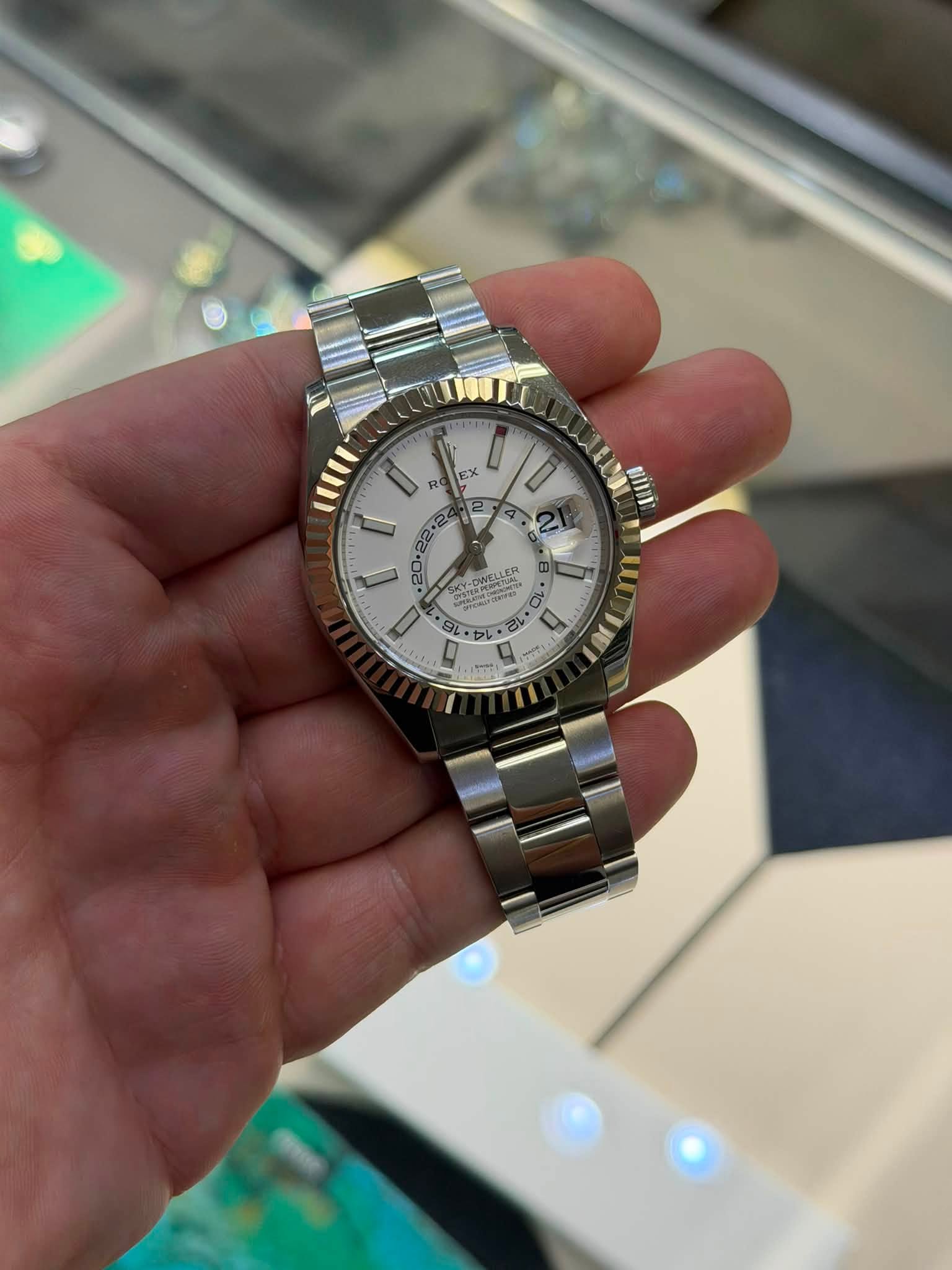 May be an image of wrist watch and text