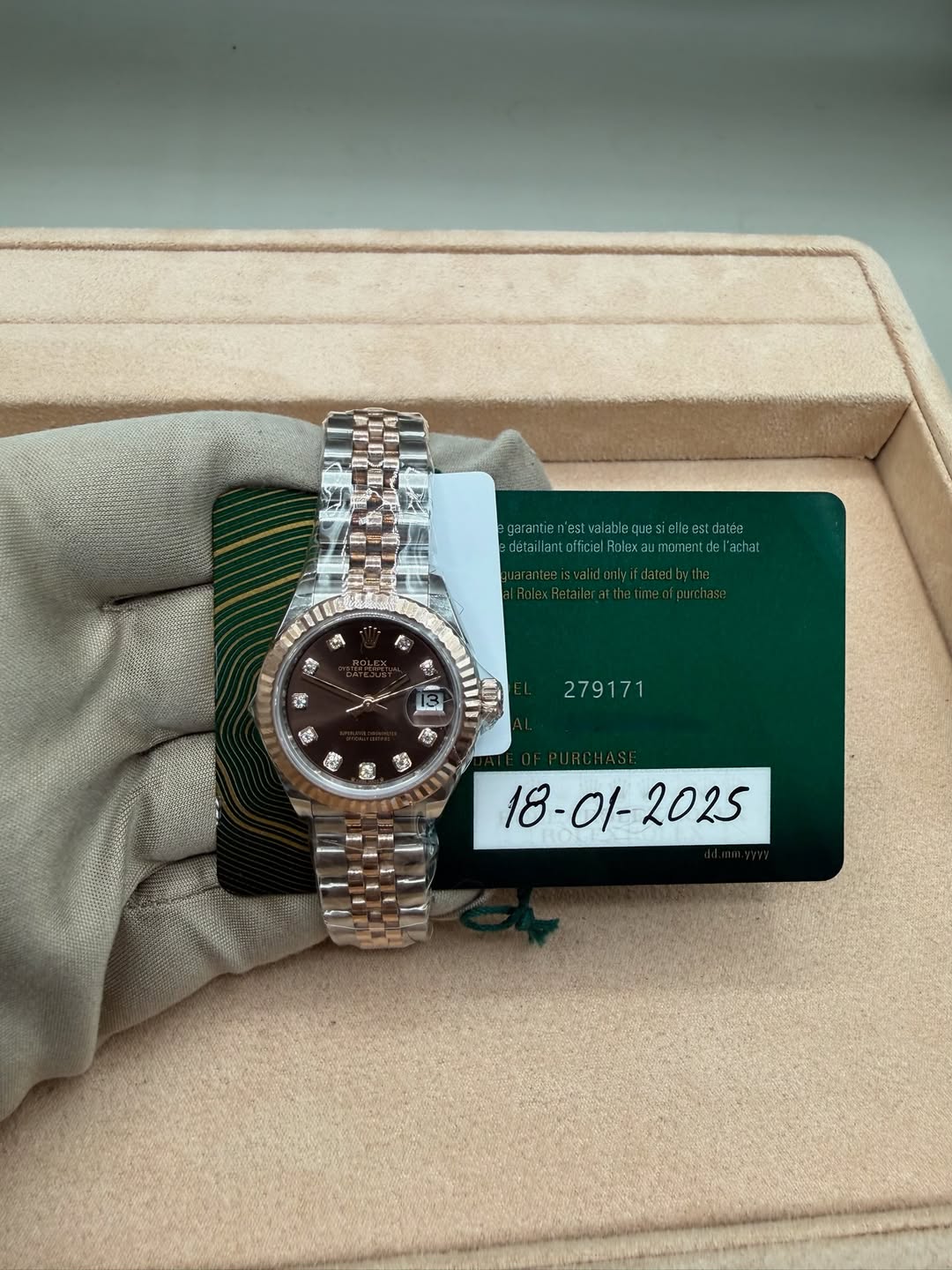 May be an image of wrist watch and text