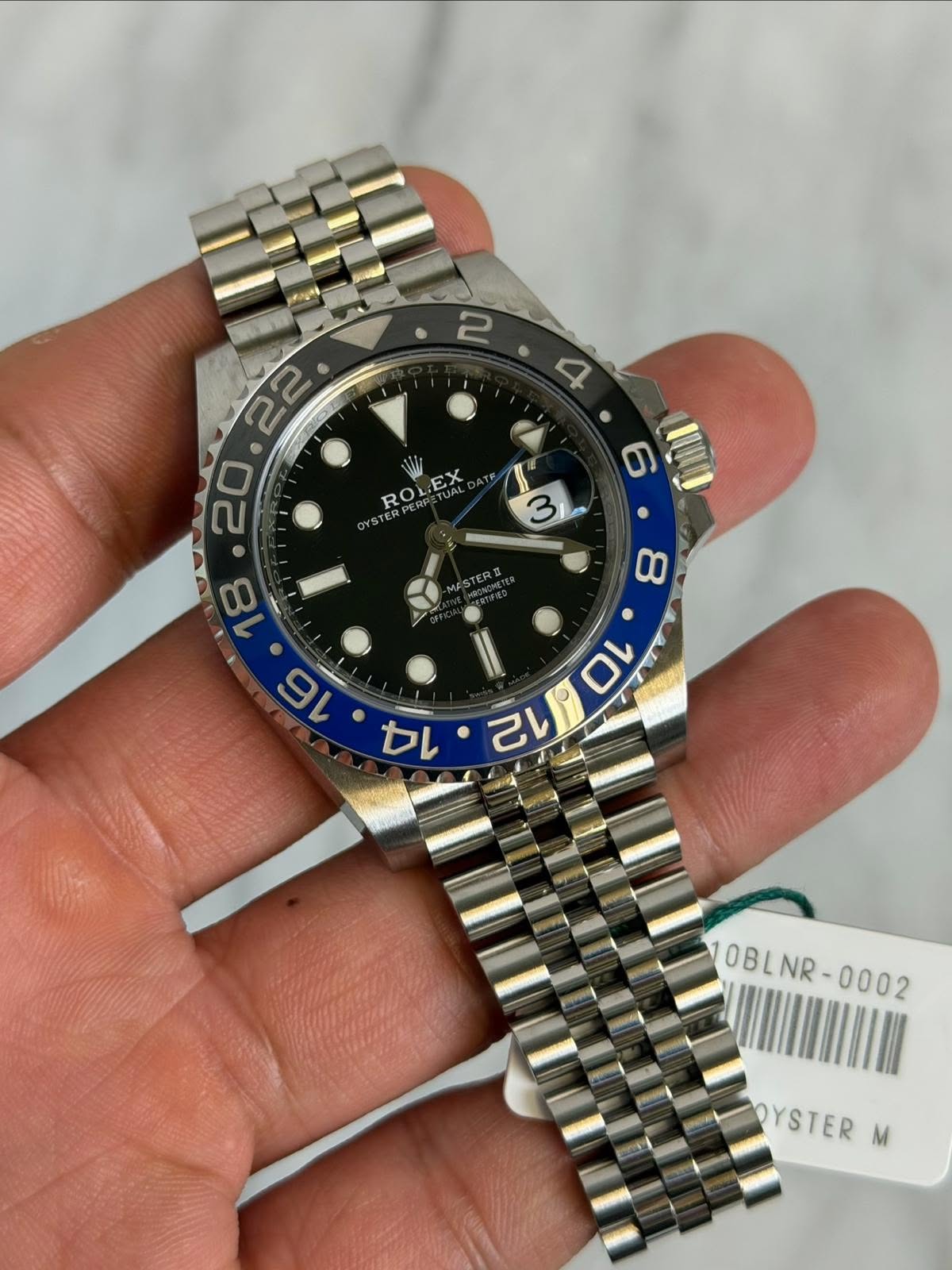 May be an image of wrist watch and text that says 'ROLI ROLEX EX YUAL YST STERPERP 3 MESTERU 8 22 ・ 20 ሙትግ 3.20 タレ・カレ か ማ 10 12 10BLNR-0002 NR -0002 10BL OYSTER M'
