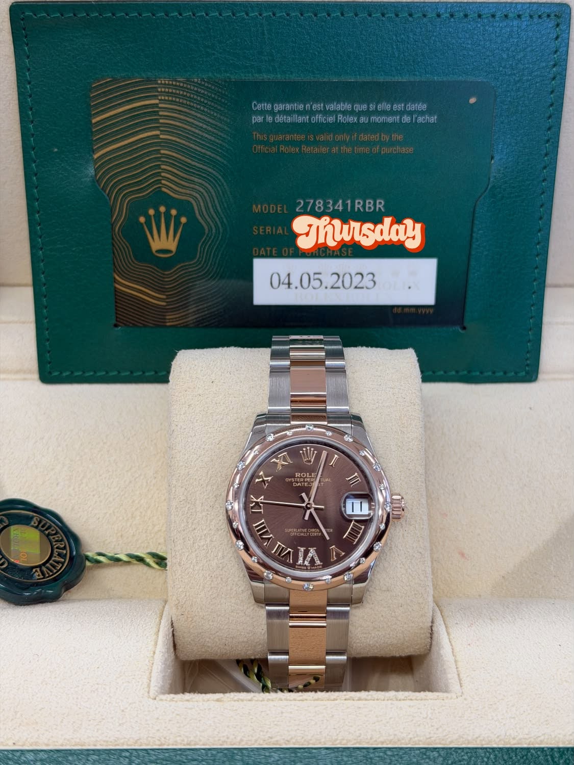 May be an image of wrist watch and text