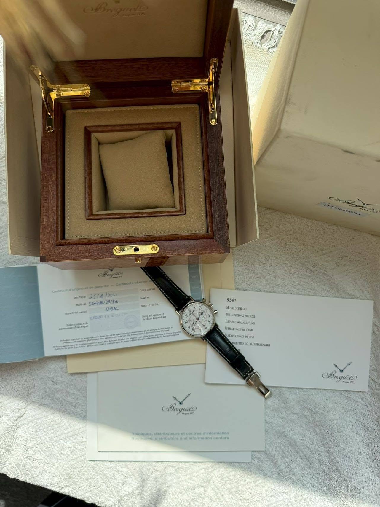 May be an image of wrist watch and text