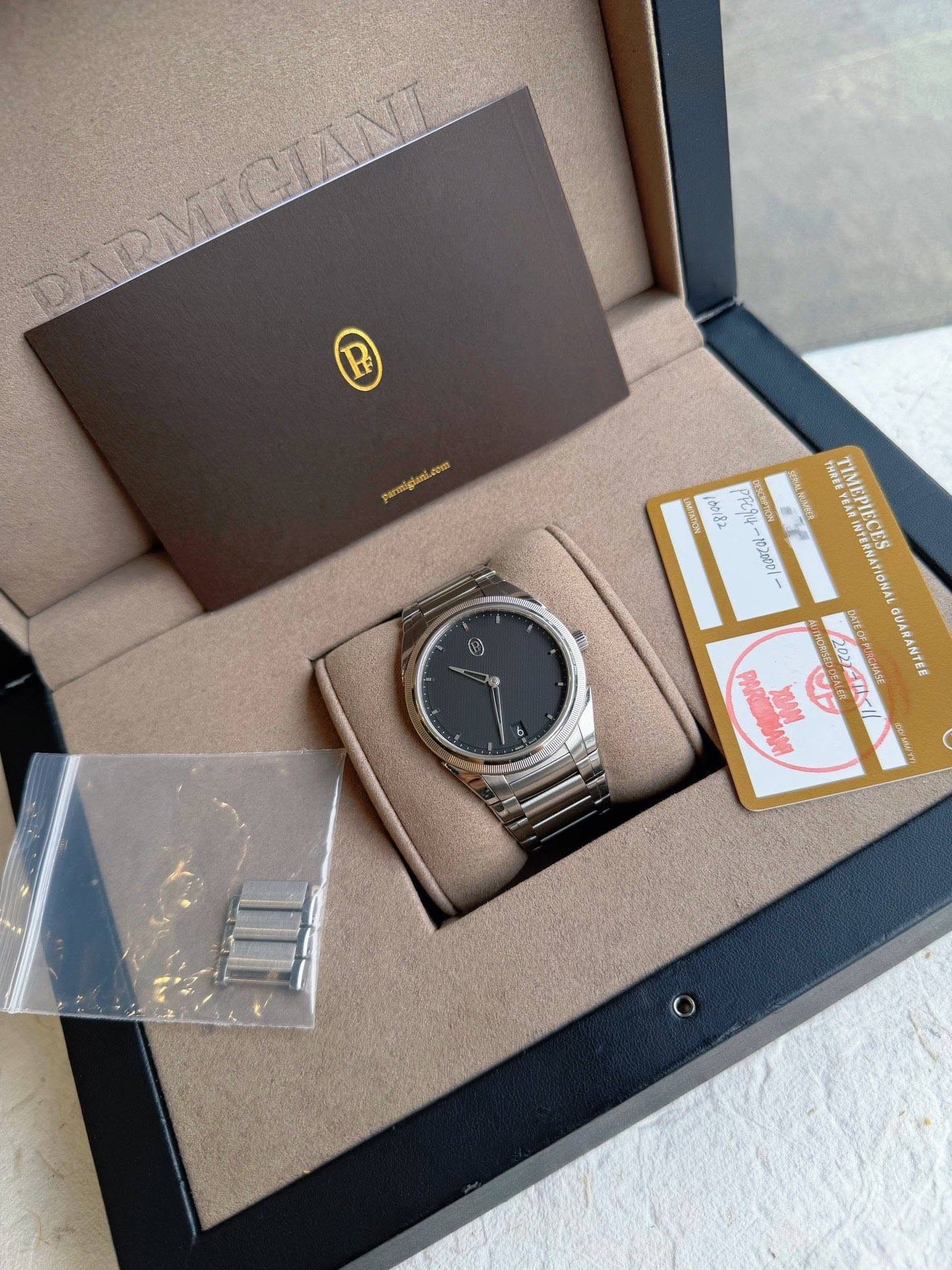 May be an image of wrist watch and text