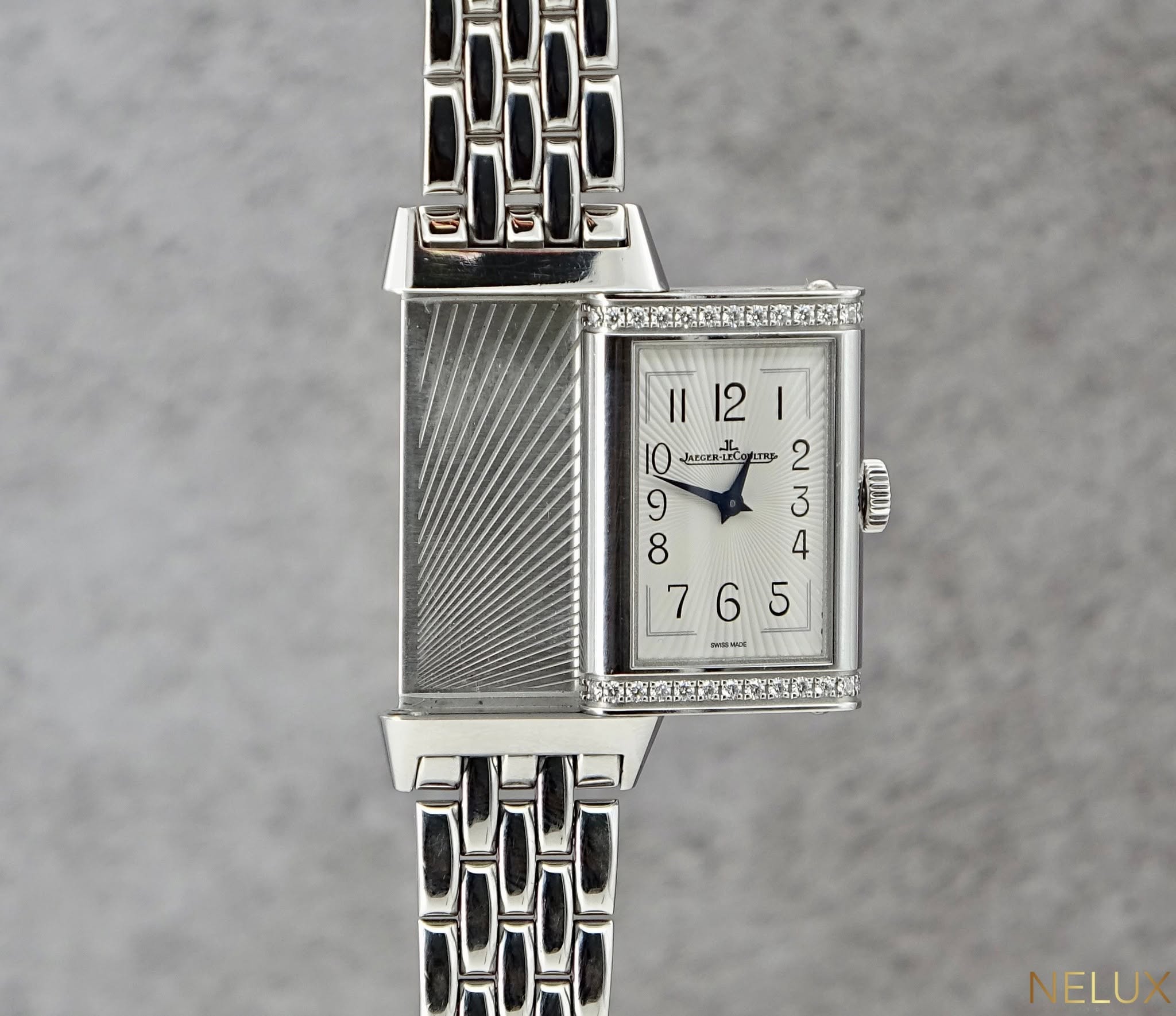 May be an image of wrist watch and text