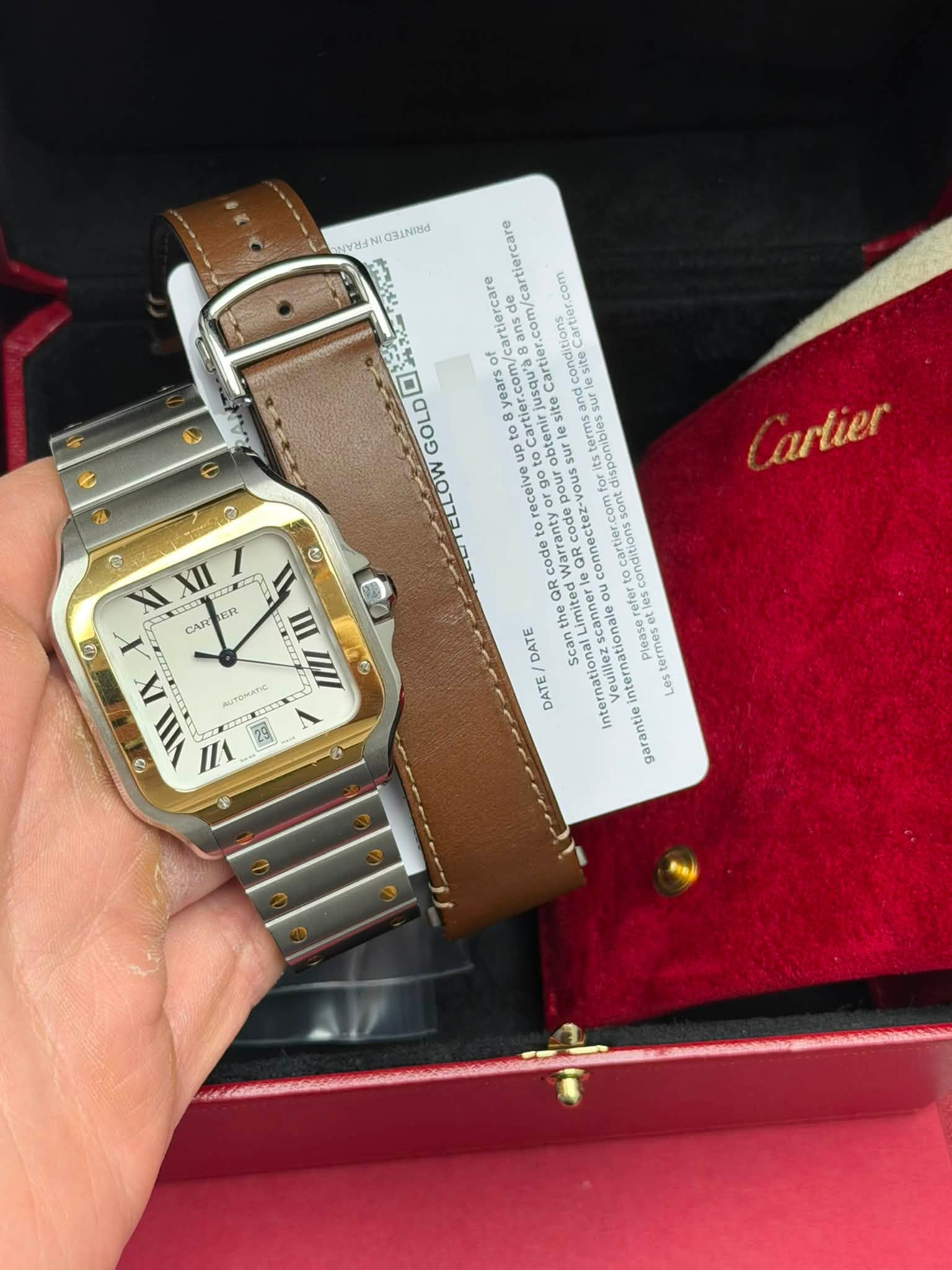 May be an image of wrist watch and text