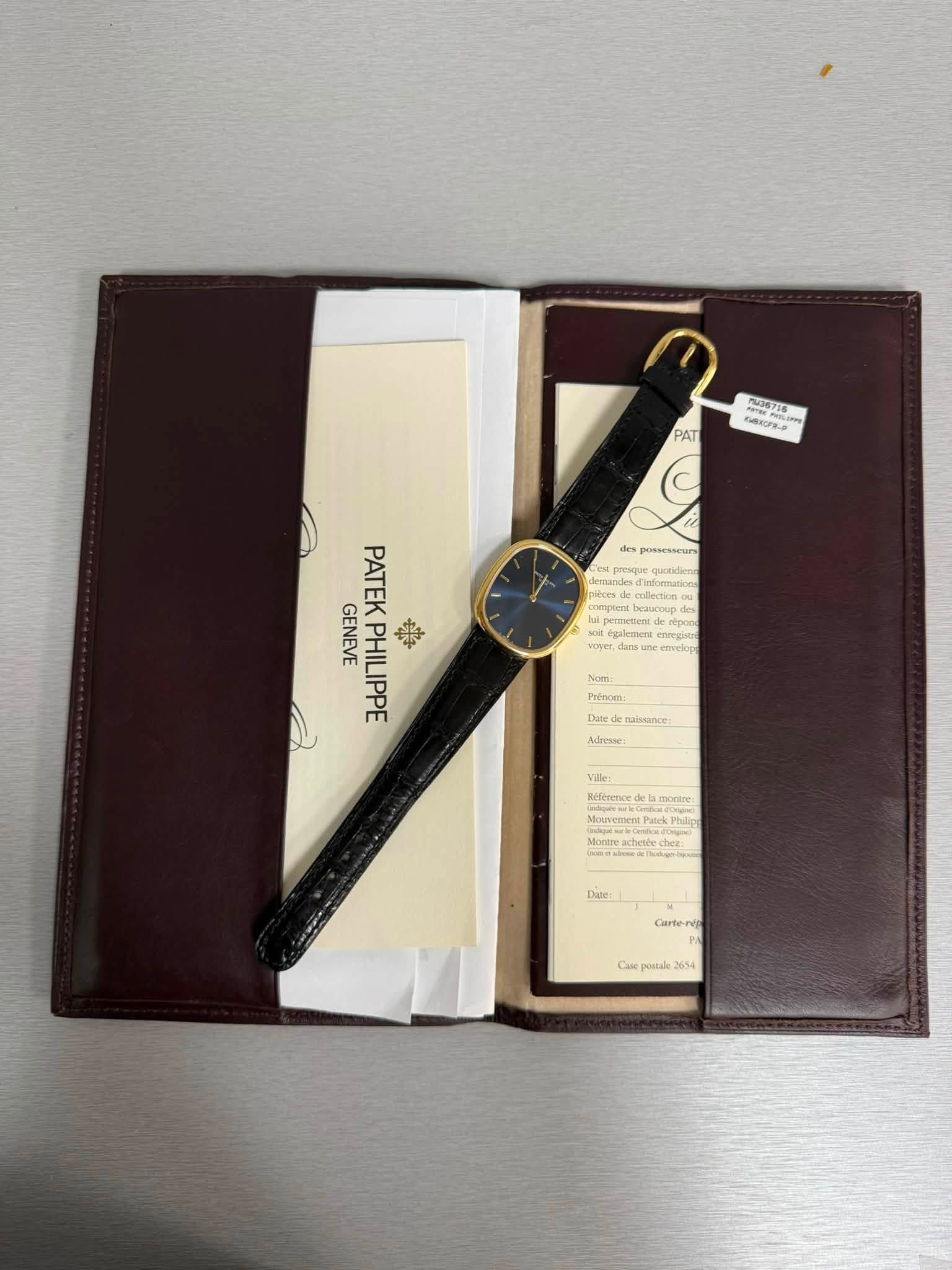 May be an image of leather wallet, leather, wrist watch, saddle-stitched leather and text