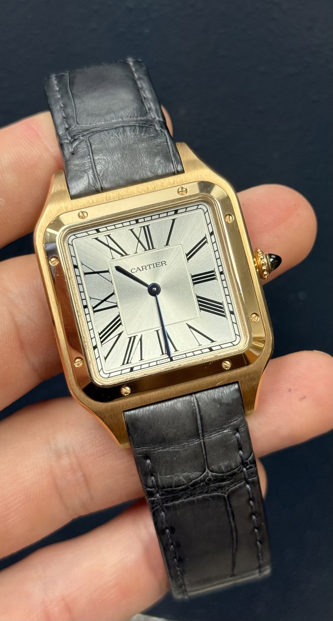 May be an image of wrist watch and text that says '色 O 0 D $ KXII/ I X XII CARTIER CARTIER X 0P I UC marro'