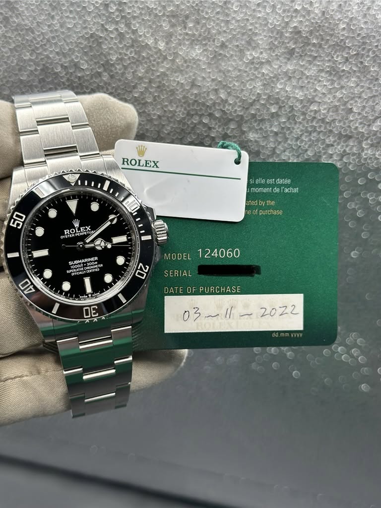 May be an image of wrist watch and text that says 'ROLEX 50 H10 ROLETUN EX ETUN ROLEX YSTER و SIE es datée moment momentdelachat de achat ated oyt the eof purchase SUBMARINER…