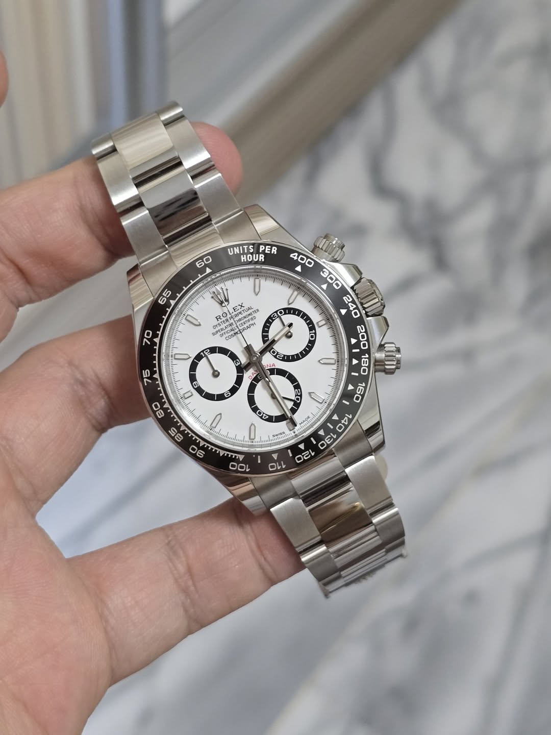 May be an image of wrist watch and text