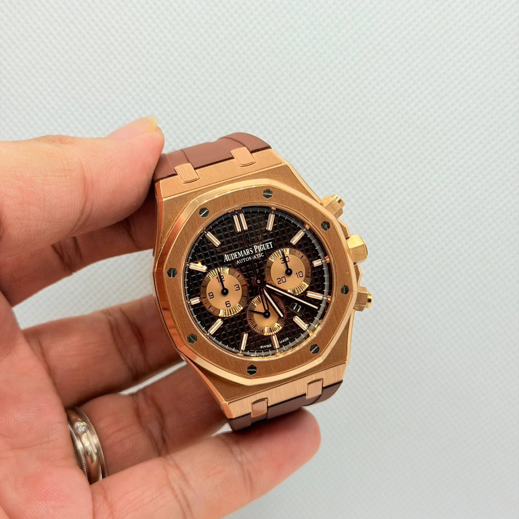 May be an image of wrist watch and text