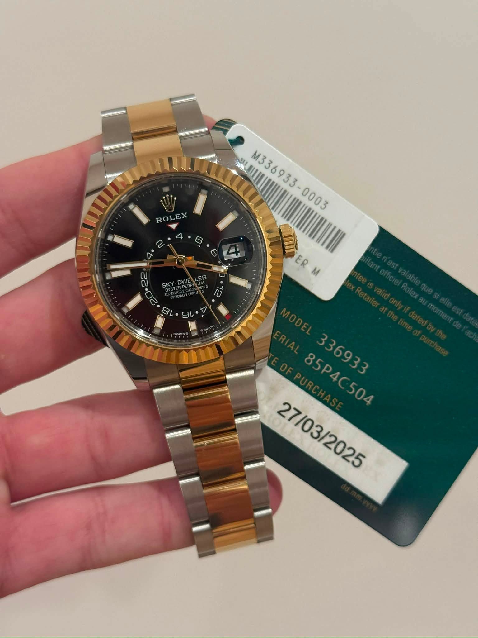 May be an image of wrist watch and text that says 'သိပပါ J M336933- M336933 ROLE 7 قنا ER こ 川 家拉 다 85P4C504 85P4C /03/2025'