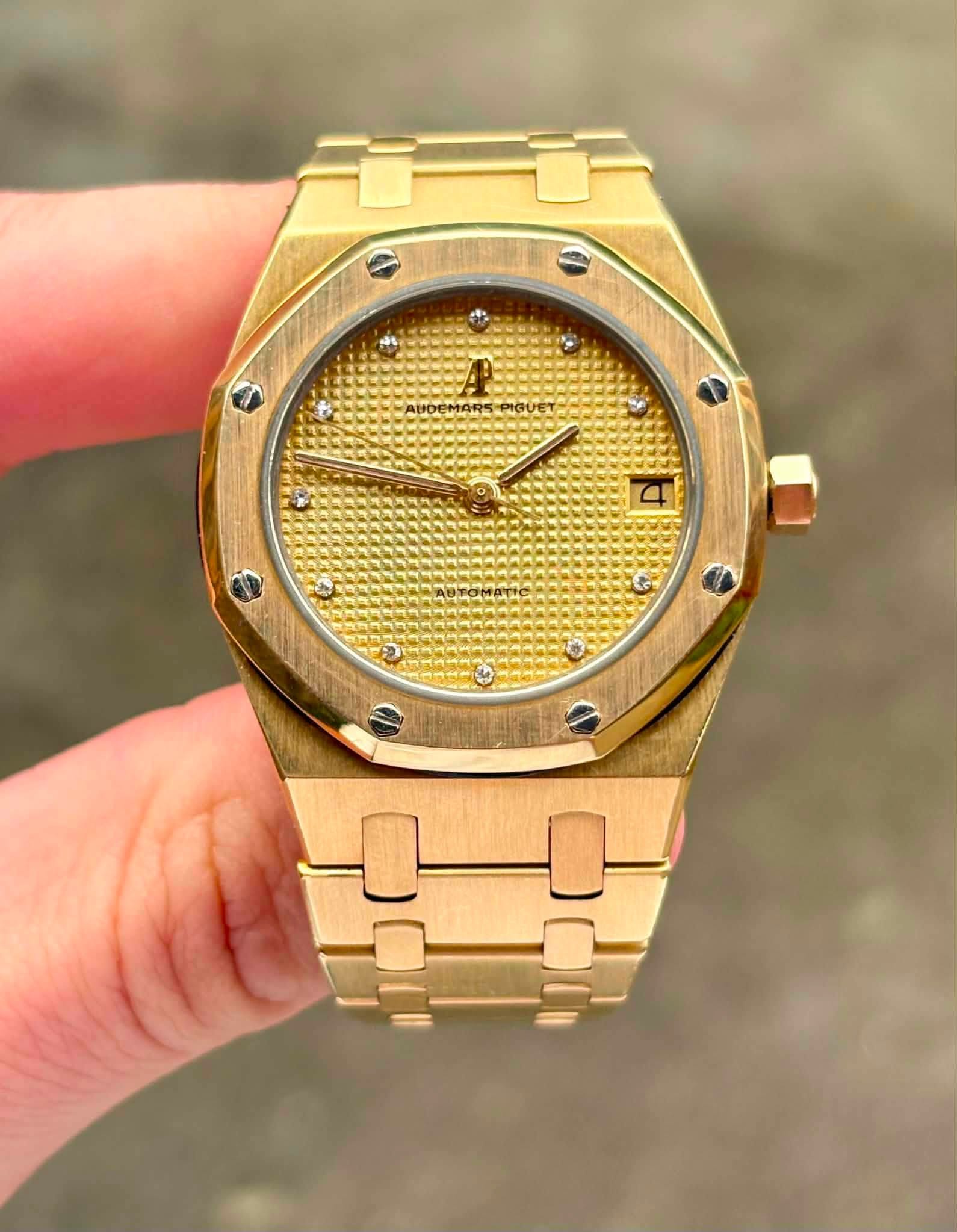 May be an image of wrist watch and text