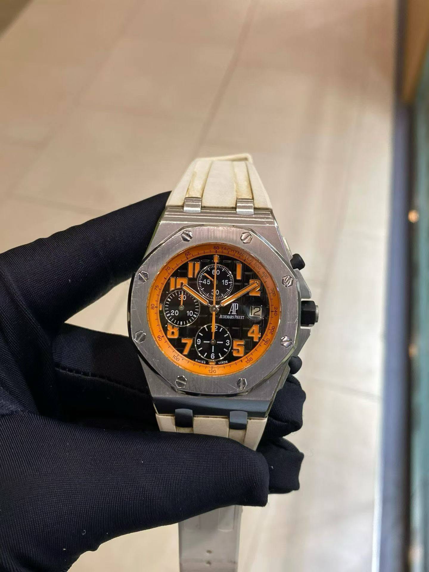 May be an image of wrist watch and text