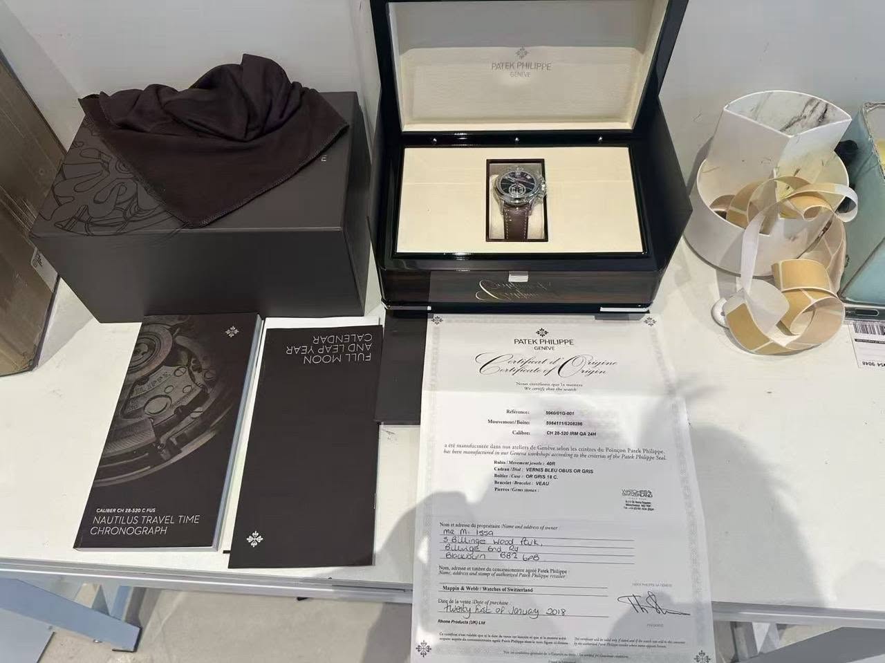 May be an image of wrist watch, fragrance and text