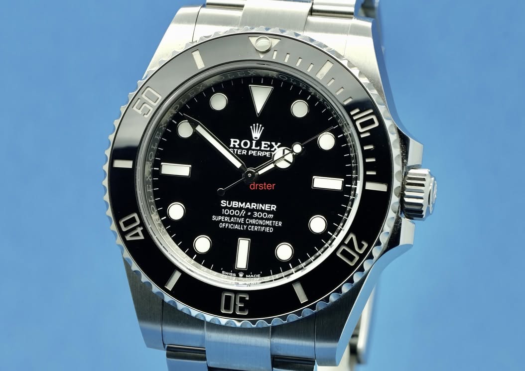 May be an image of wrist watch and text that says '50 ROLEX TER TERPERPET PE PERPE う i 10 drster SUBMARINER 1000ft 300m SUPERLATIVEC PERLATIVECHRONOMETE CHRONOME TER OFFICIALLY…