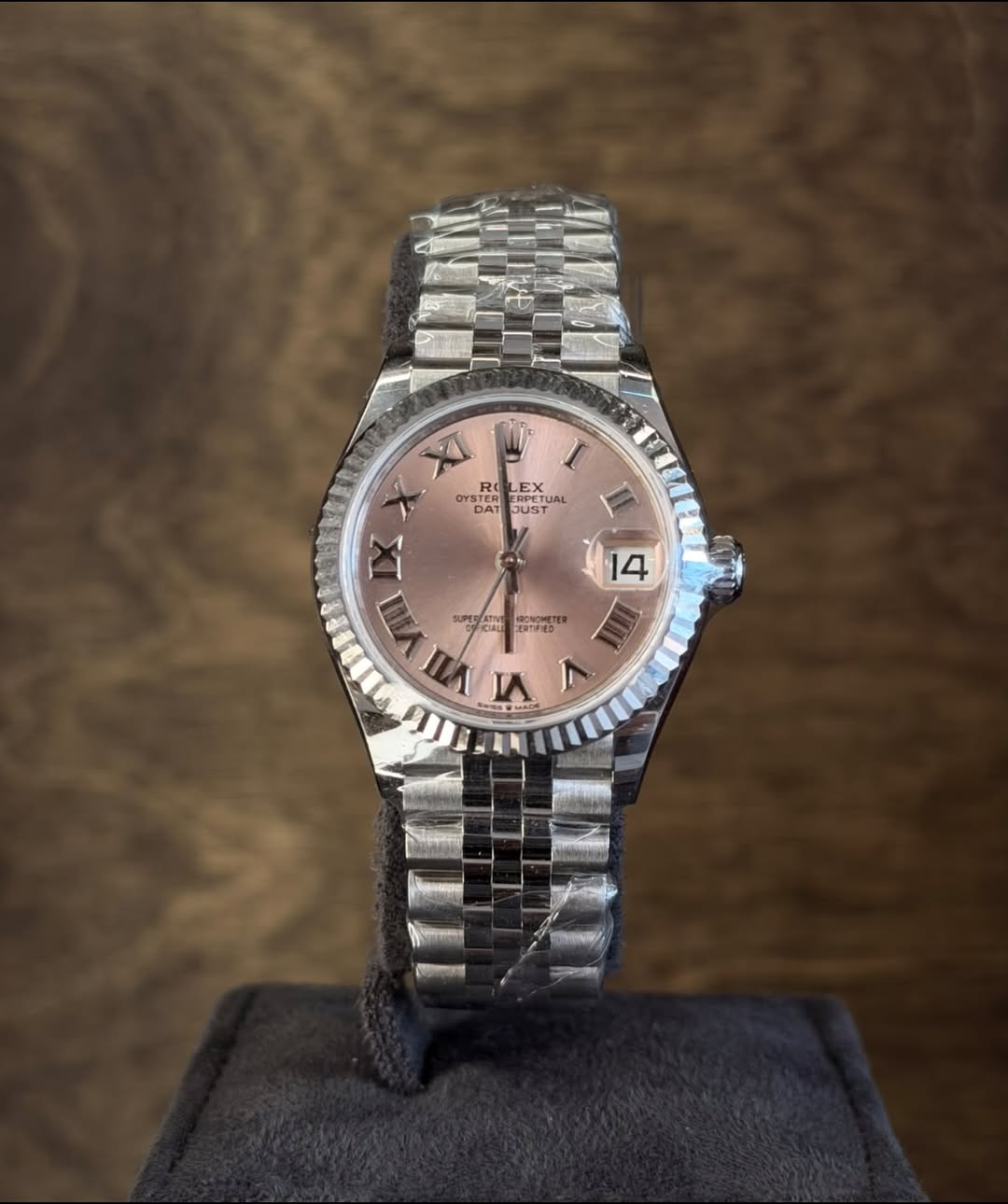 May be an image of wrist watch and text