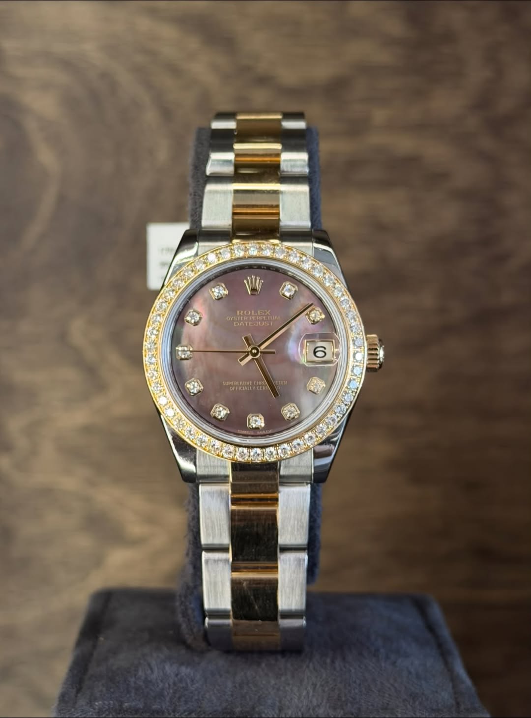 May be an image of wrist watch and text