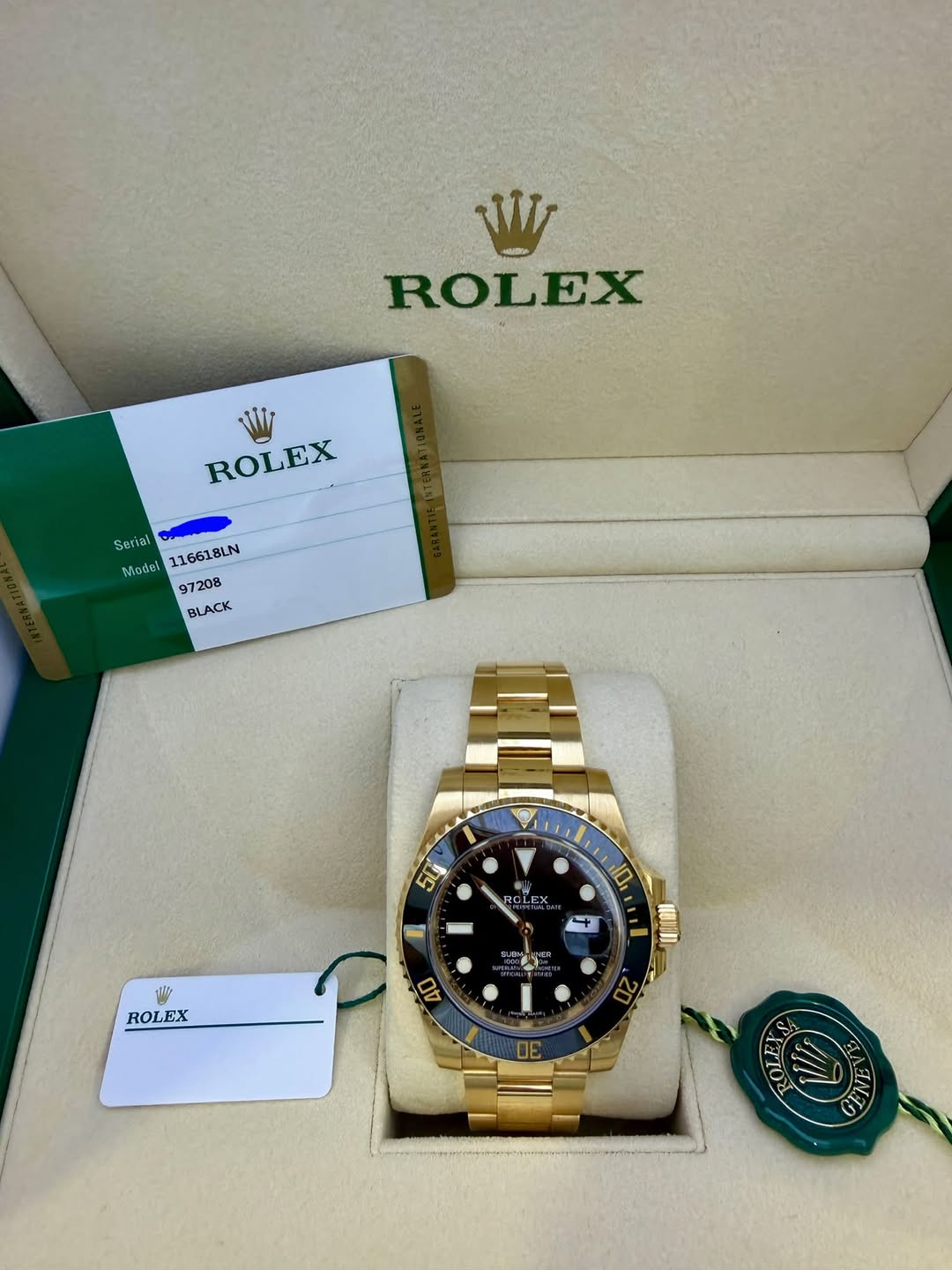 May be an image of wrist watch and text that says 'VI MADA ROLEX WI ROLEX Seriat Model 116618LN 97208 BLACK れ 50j ROLEX 茶 10 4 ه ROLEX 和1 ្ពុក 40 12 5'