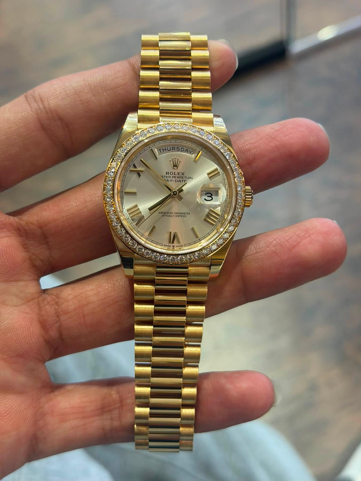 May be an image of wrist watch and text