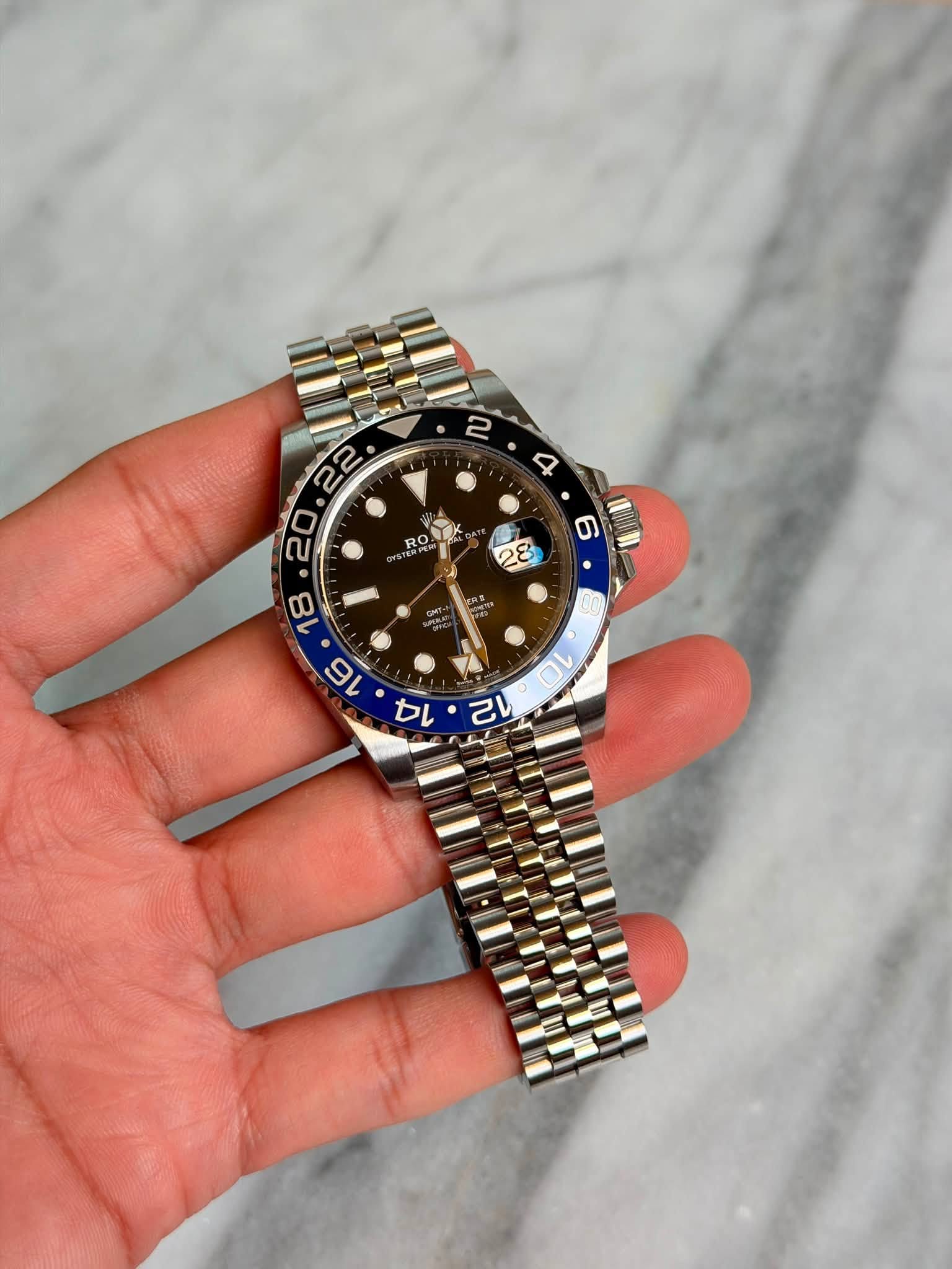 May be an image of wrist watch and text