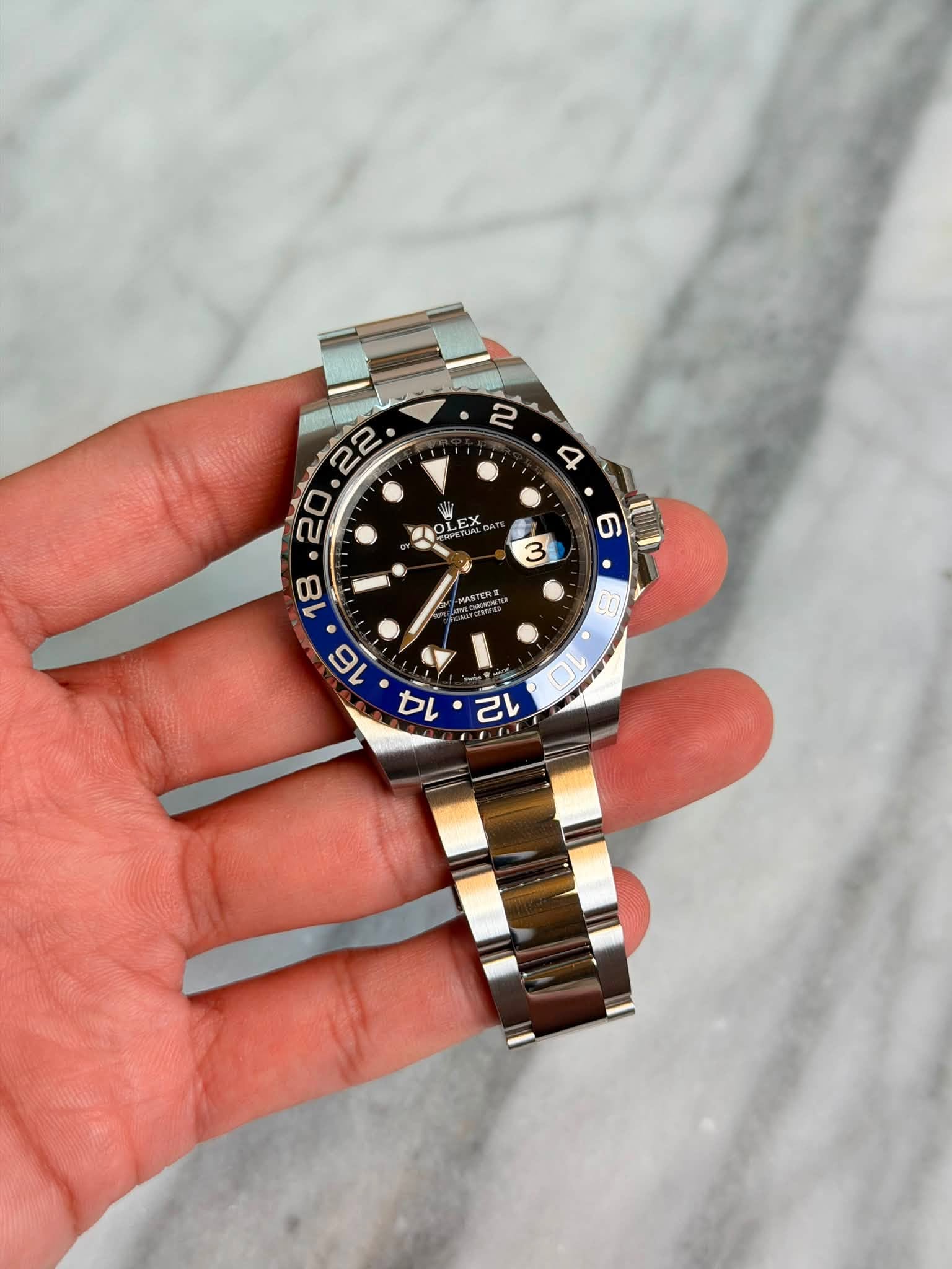 May be an image of wrist watch and text