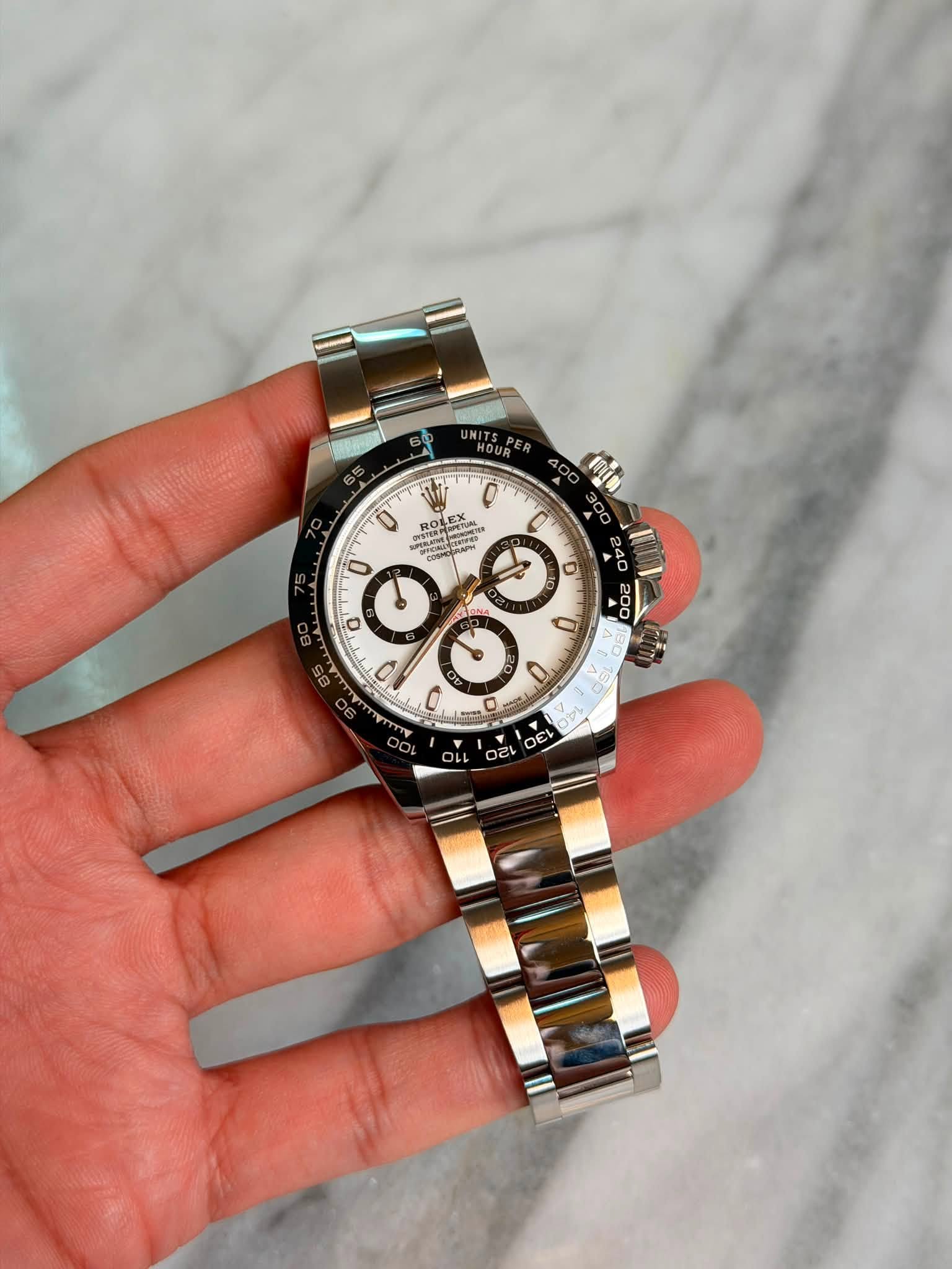 May be an image of wrist watch and text