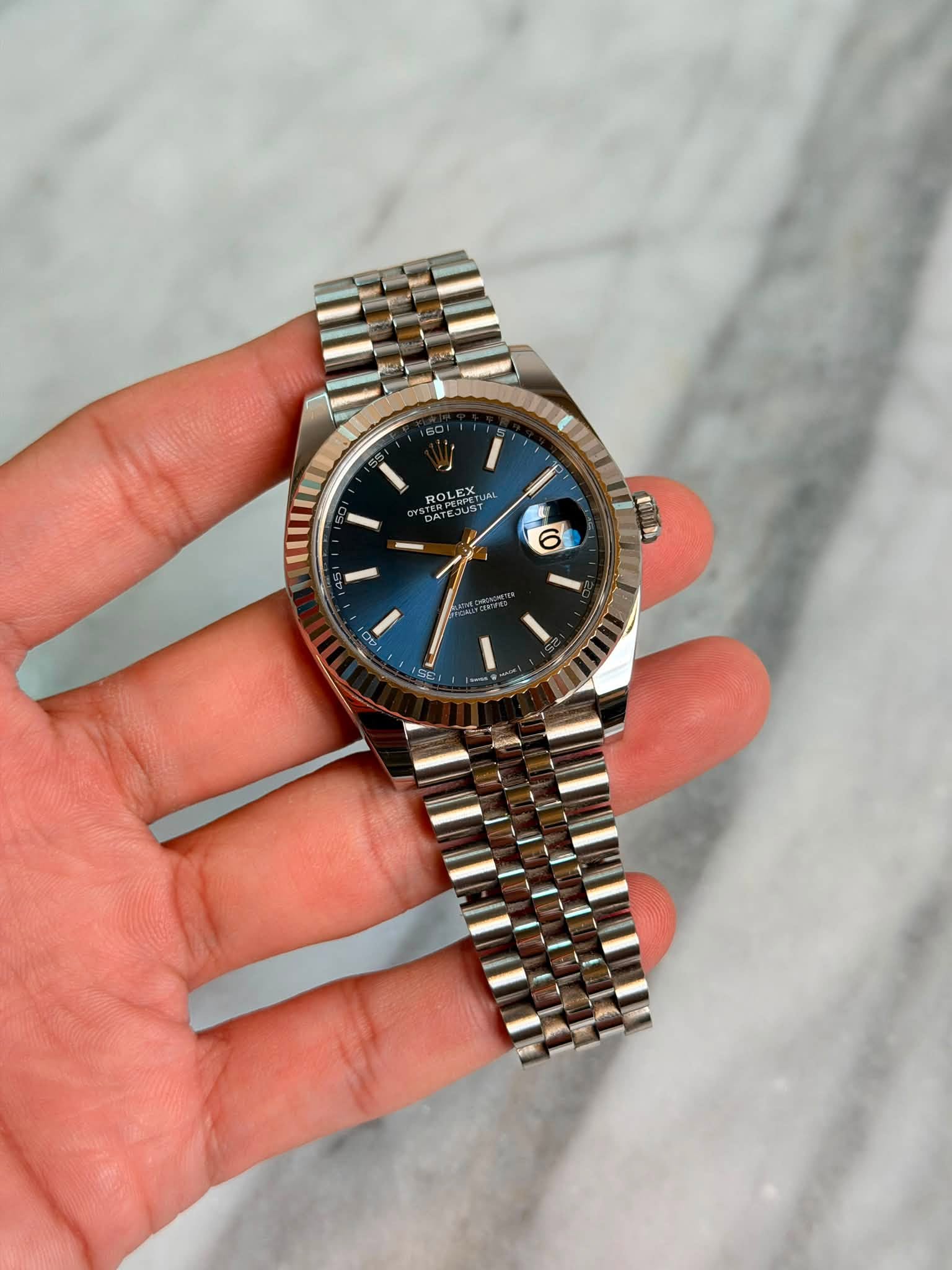 May be an image of wrist watch and text that says 'ROLEXUM JAL TERPEYST ROLE የር 6 6'