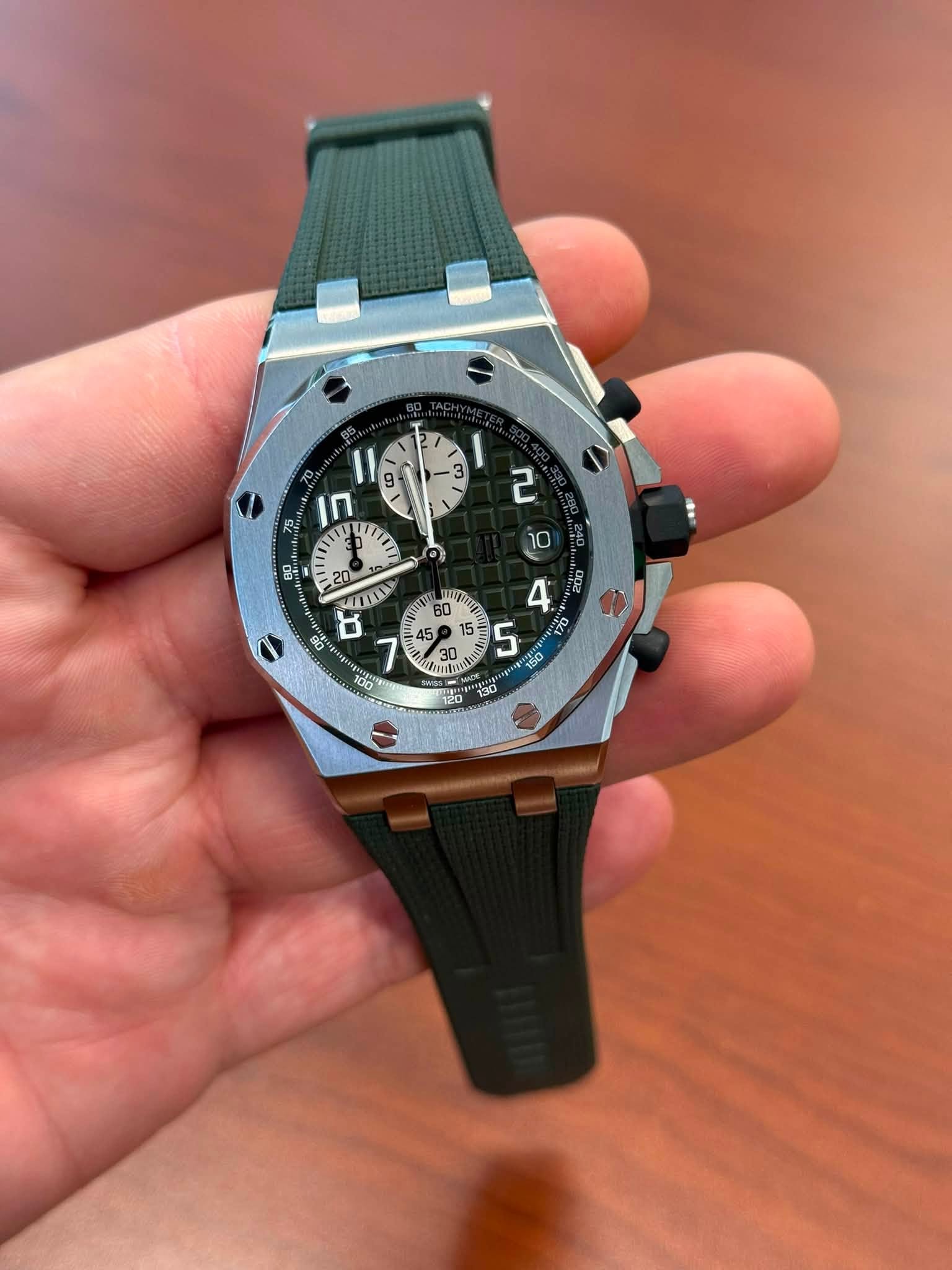 May be an image of wrist watch and text