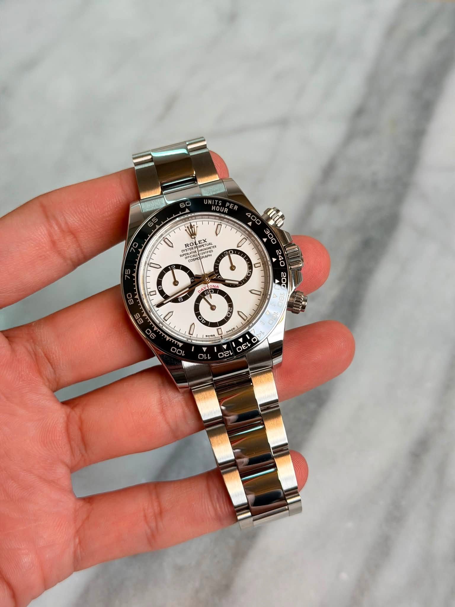 May be an image of wrist watch and text