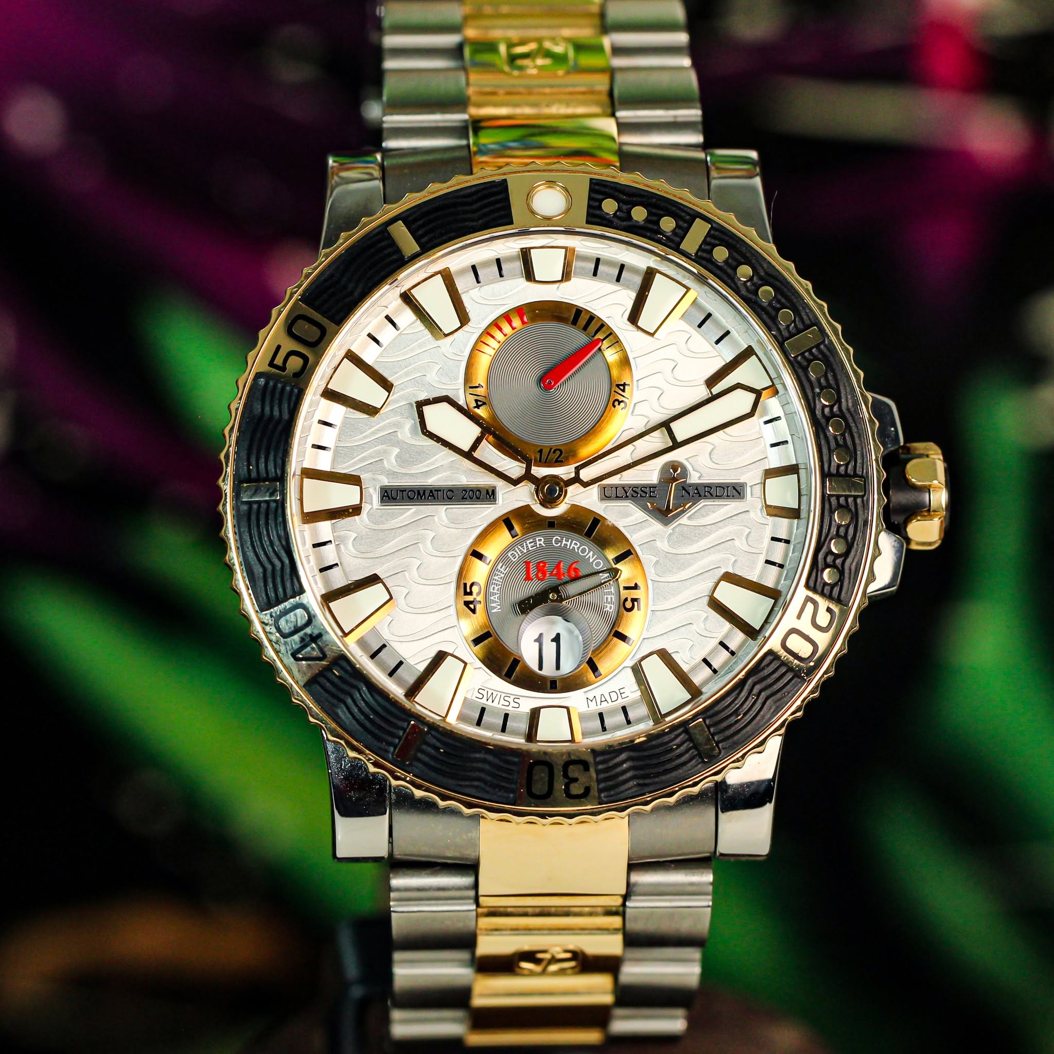 May be an image of wrist watch and text that says 'SE T3E 1846 CHRON 45 45 9 ب 11 SWES MADE 20 12'