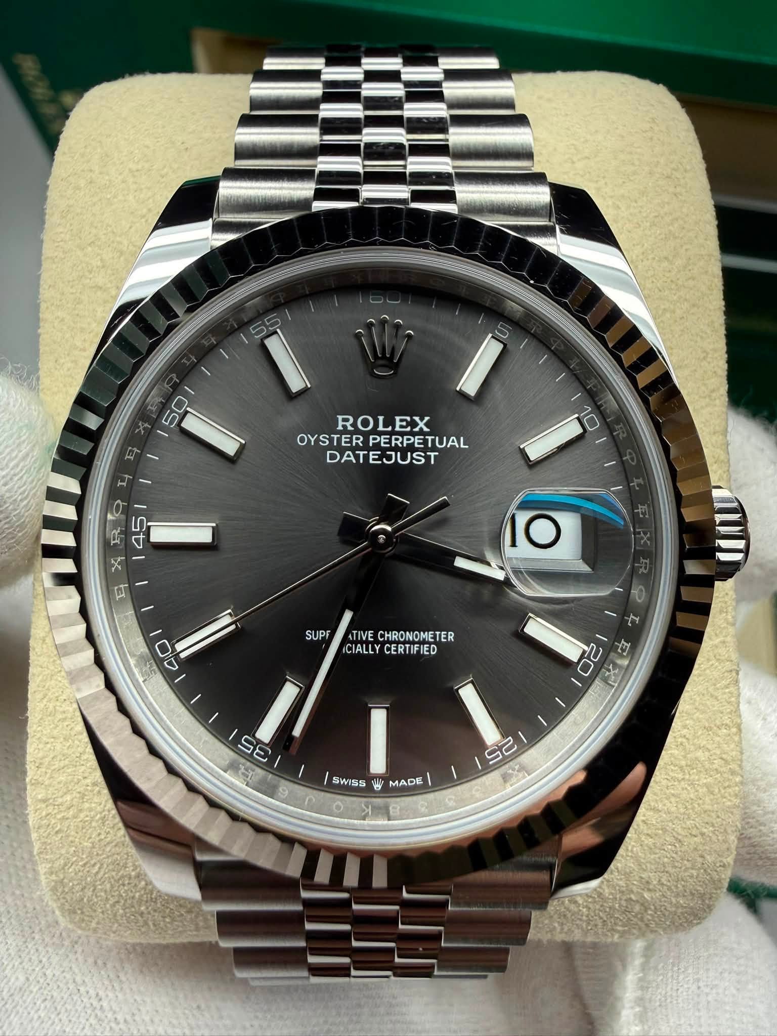 May be an image of wrist watch and text that says 'E 50 50 ROLEX OYSTER PERPE OYSTERPERPETUAL TUAL DATEJUST 10 RA 45 እዳ E O SUPF 40 TIVE IVECHRONOMETER CHRONOMETER CIALLY…