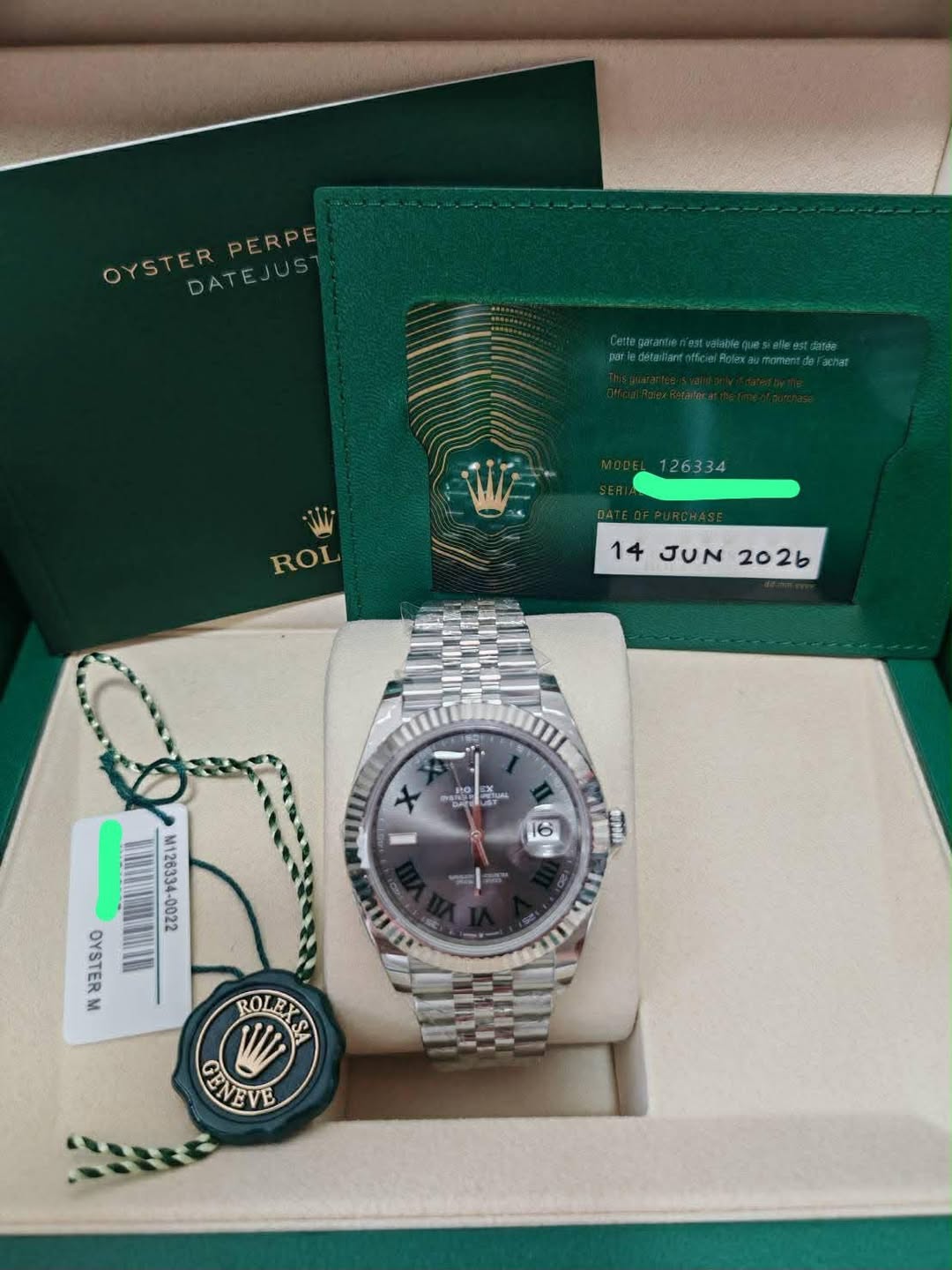 May be an image of wrist watch and text