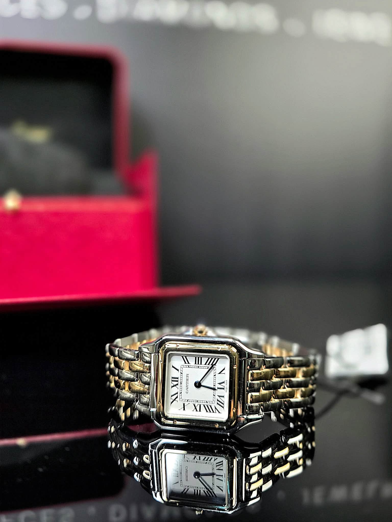 May be an image of jewelry, digital watch and text