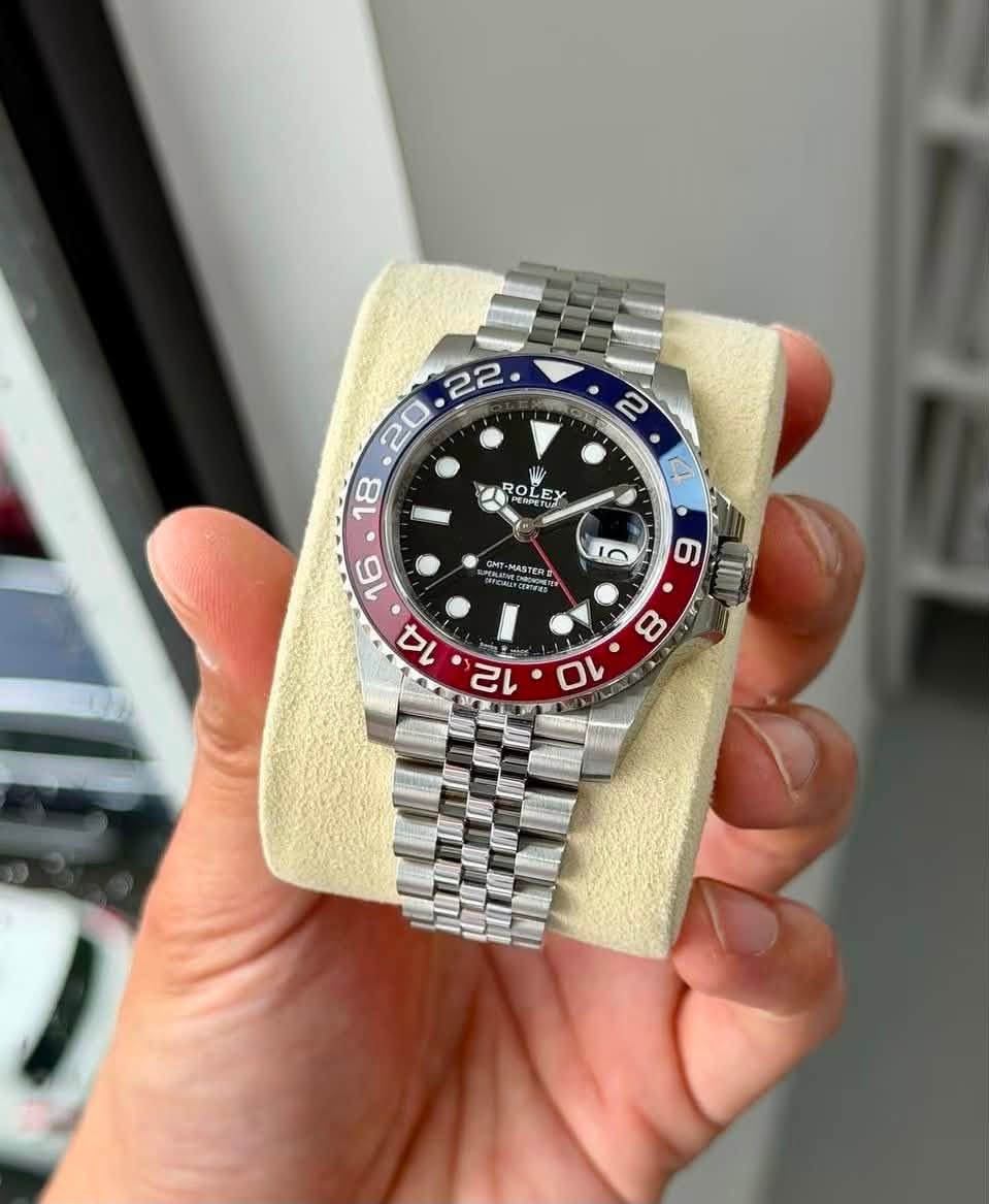 May be an image of wrist watch and text