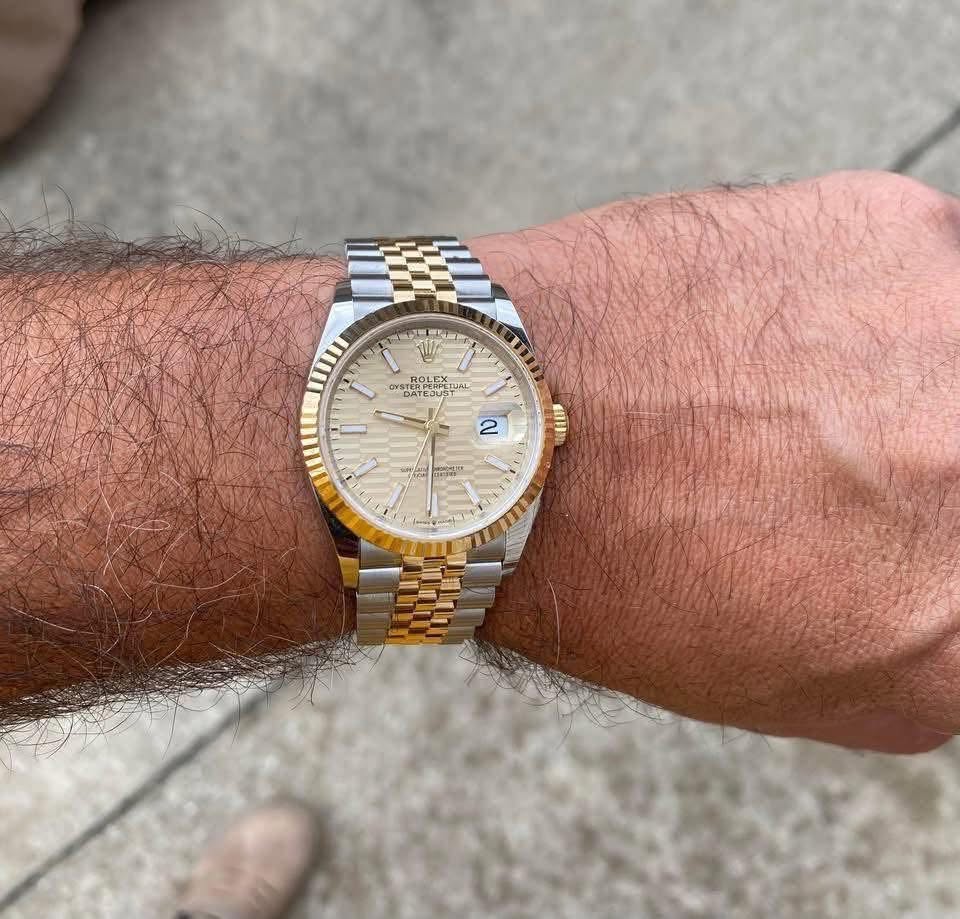 May be an image of wrist watch