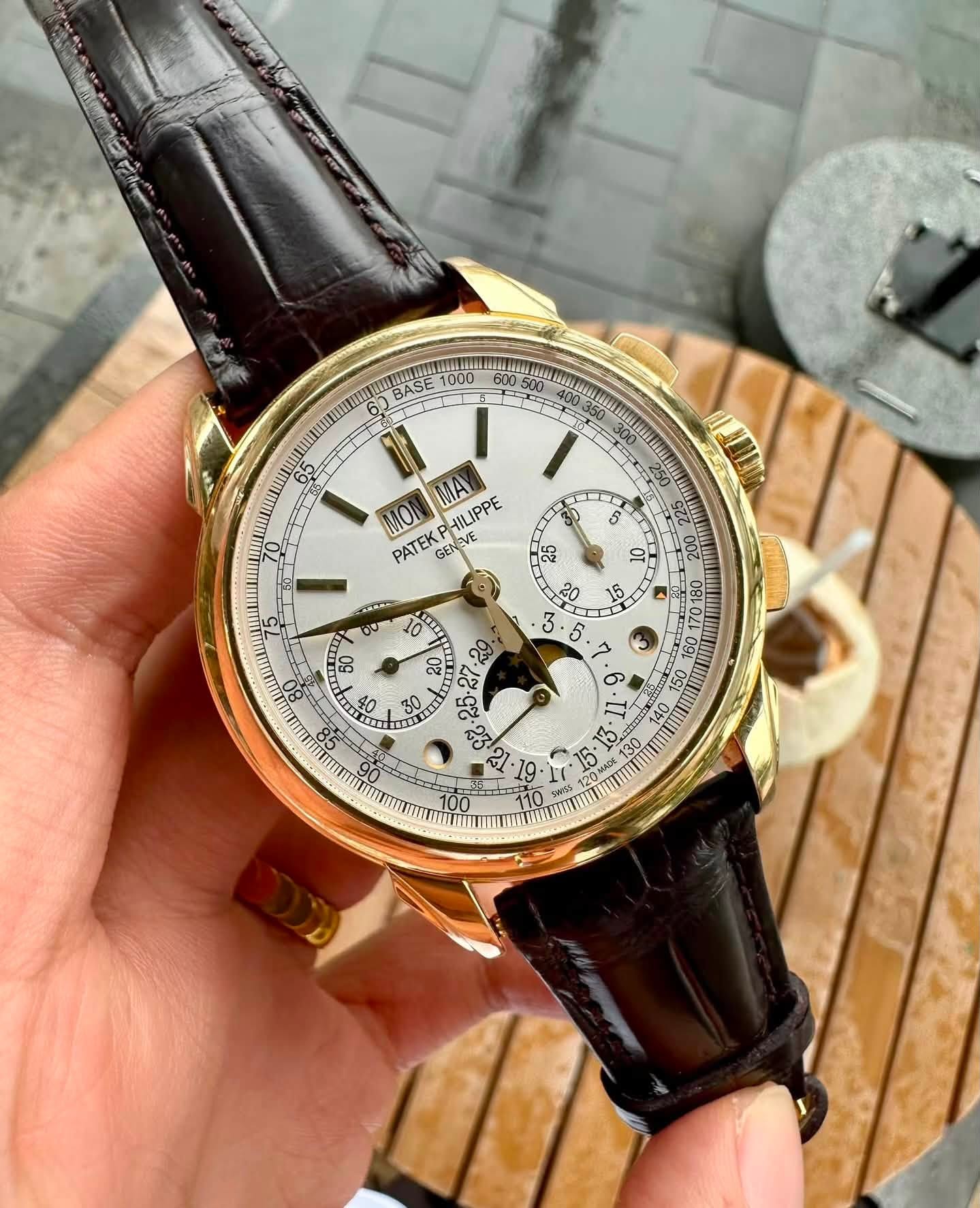 May be an image of wrist watch and text