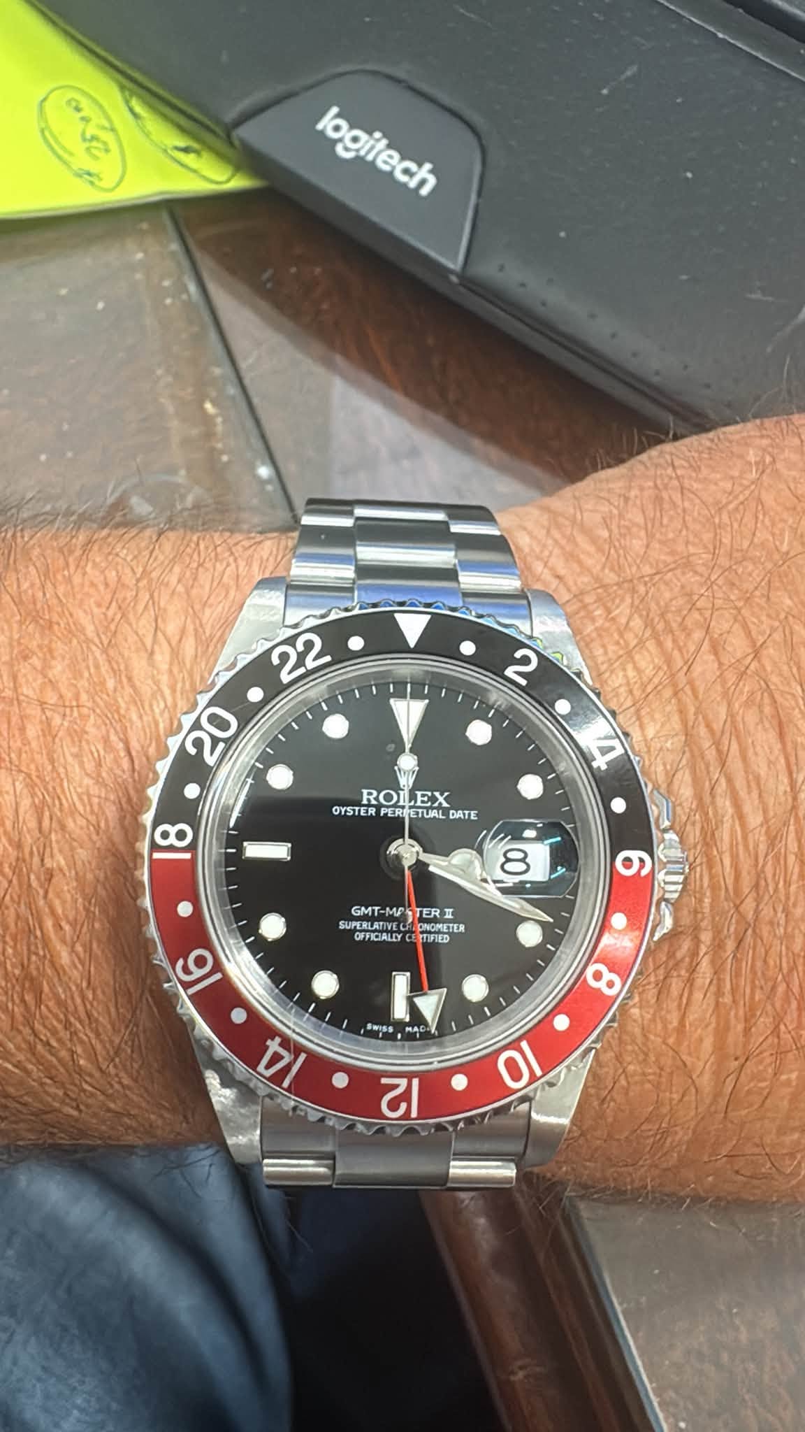 May be an image of wrist watch and text