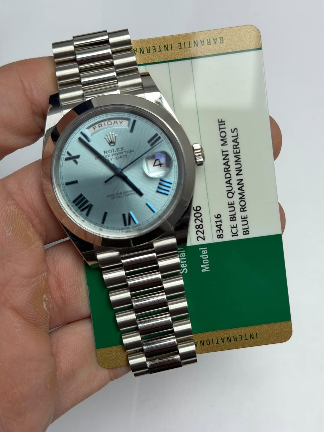 May be an image of wrist watch and text that says 'NITENE BAAAAAIN FRIDAY FRIDAY Wi ROLEX Y-DATE PERPEUL X IIII MOTIF NUMERALS 新红静 QUADRANT 228206 BLUE ROMAN 83416 ICE BLUE Seria…