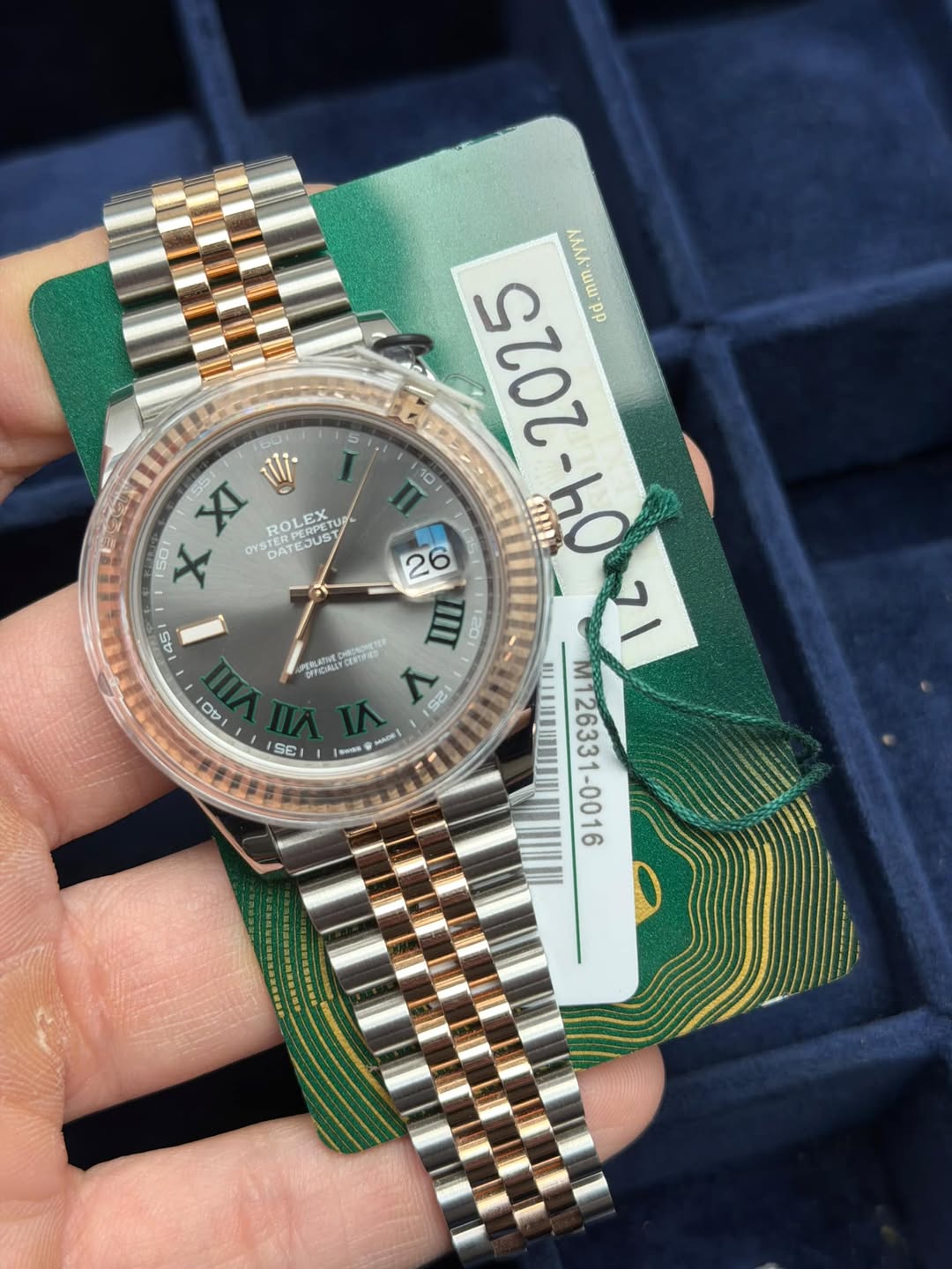 May be an image of wrist watch and text