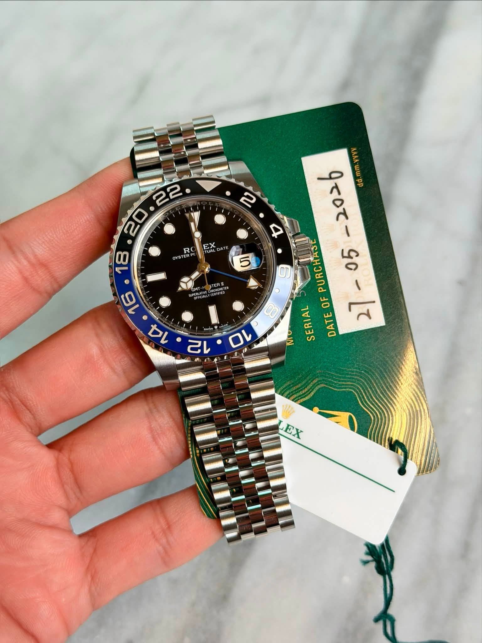May be an image of wrist watch and text that says '22 20 BO EX R 5 STERE O 6 PURCHASE 8 OF Mo SERIAL TEOFPURCHASE DATE EX'