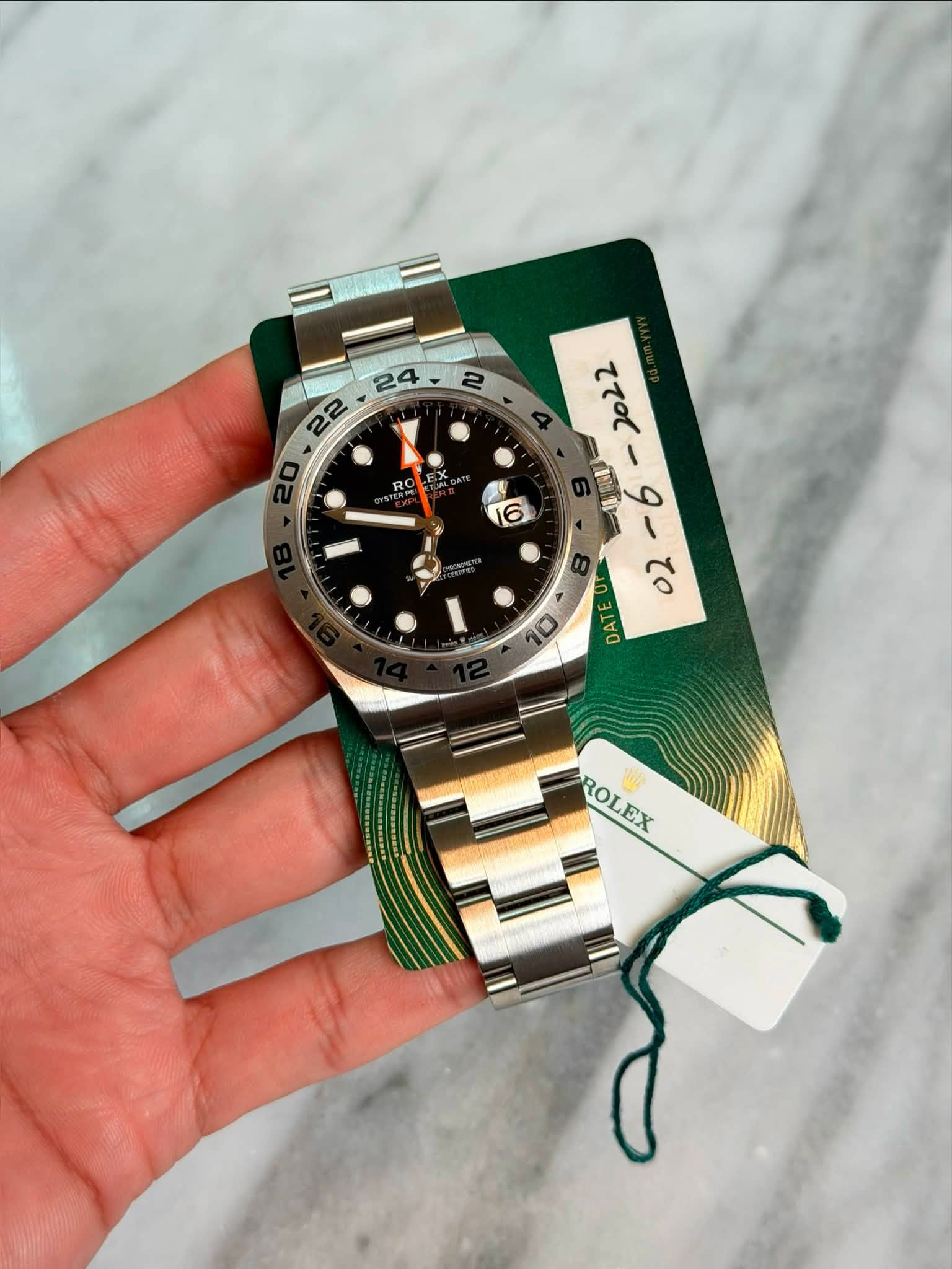 May be an image of wrist watch and text
