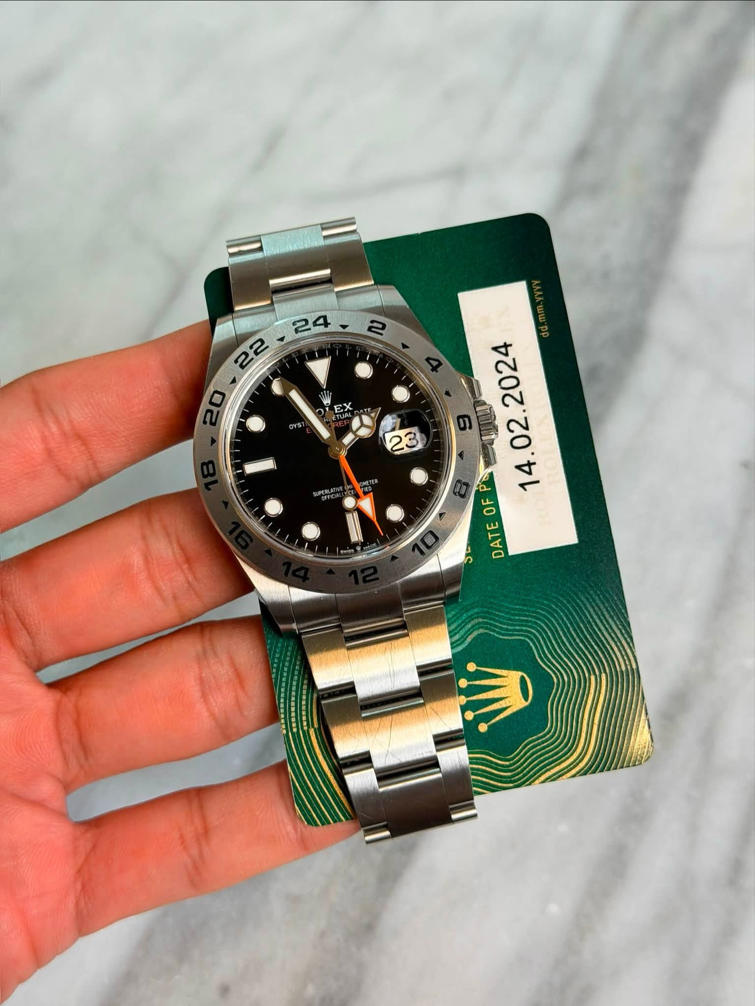 May be an image of wrist watch and text
