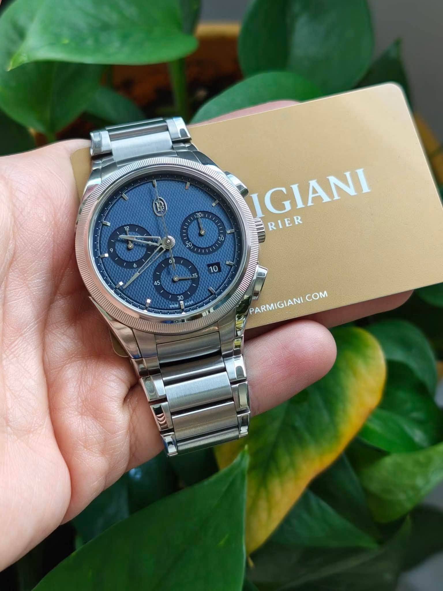 May be an image of wrist watch and text that says '201 0 6) IGIANI RIER AH thua Gnld PARMIGIANI PARMIGIANICOM COM'