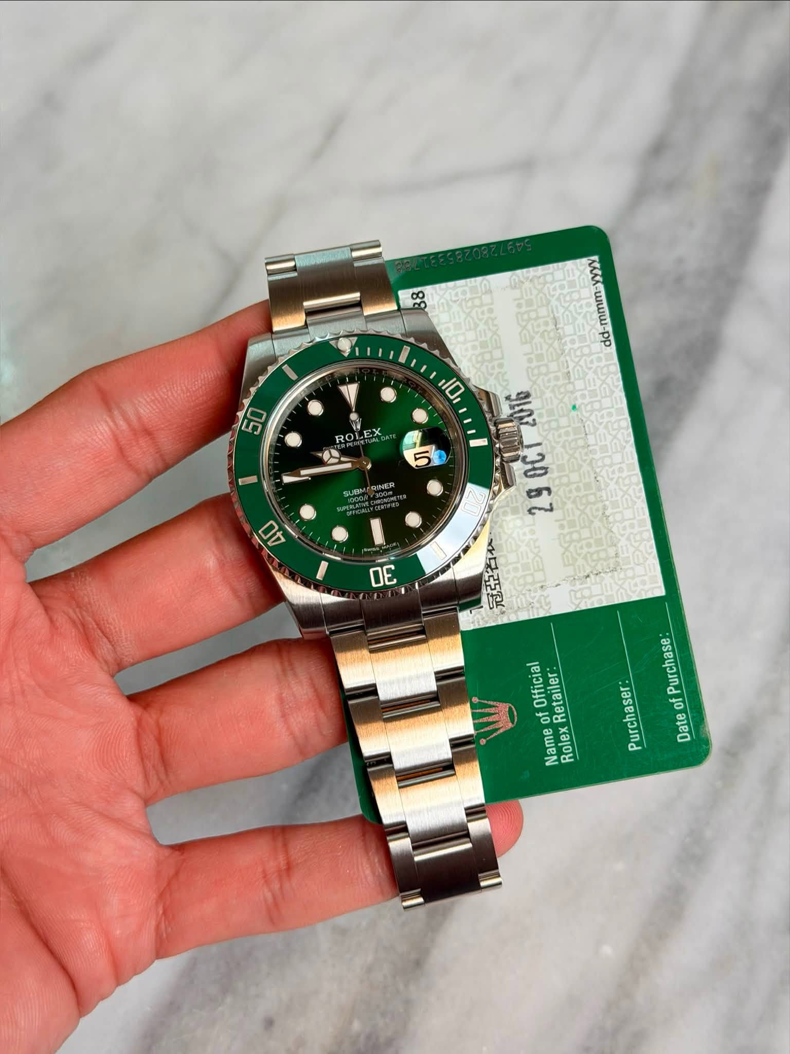 May be an image of wrist watch and text that says '50 ROL 公 5 SUBH 0U dd-mmm- 10 gpe وز နပ်း 29 冠亞谷 원로 OE Official OF Retailer Name Rolex Rolex Purchase Purchaser: of Date'