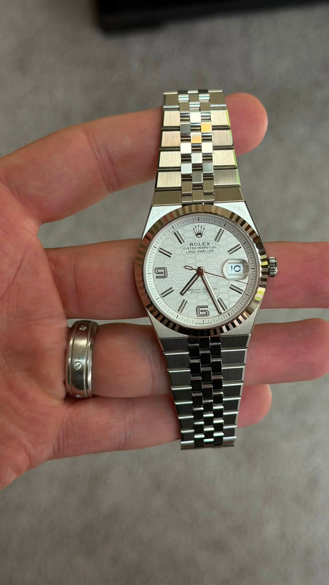 May be an image of wrist watch and text