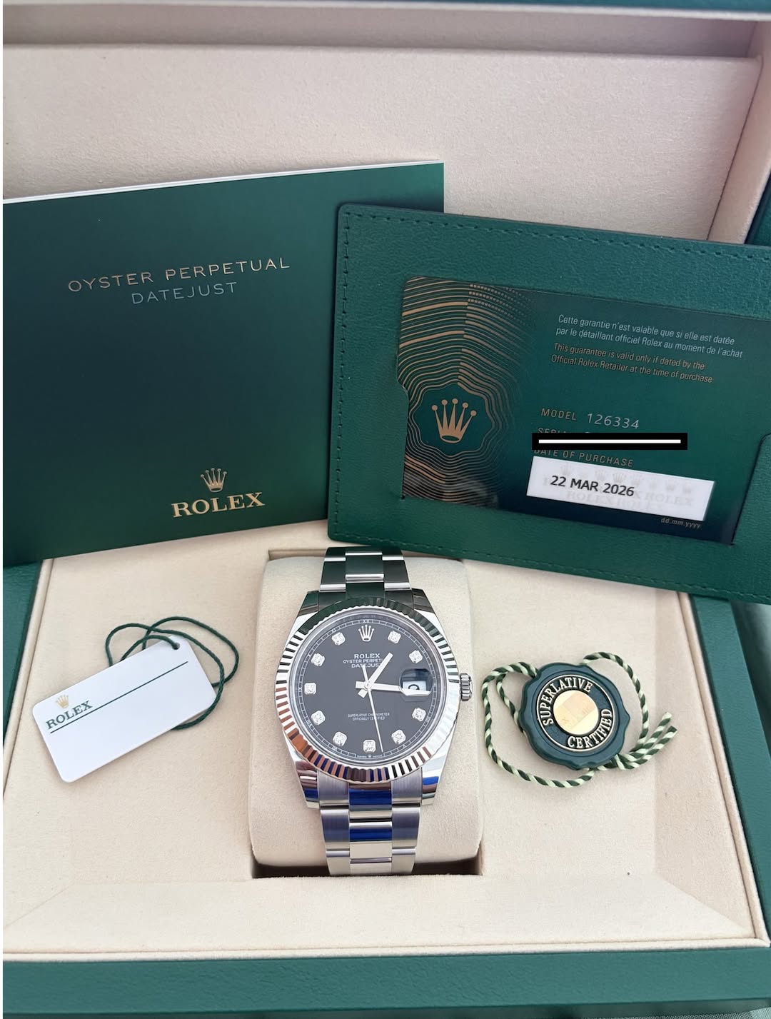 May be an image of wrist watch and text that says 'OYSTER PERPETUAL YSTERPERPETUAL ETUAL DATEJUST 미는버드 อล 126334 ROLEX 22 MAR 2026 ROLE ROL ROLEX KX EX មម្ស c c و 1 SUPERUA…